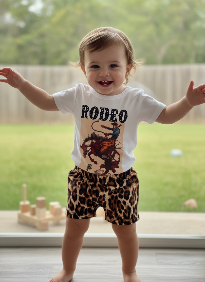 Fun Bucking Bronco Rodeo Outfit for Your Little Cowgirl! 🌟
Get your little one ready for adventure with our Western Rodeo Cowboy Short Set! This adorable outfit features a playful bucking bronco design, shorts boast a trendy cheetah print