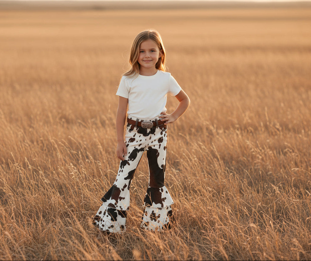 girl wearing Girls_Cow print_Cowgirl_Jeans by Razels boutique ships free with $35+ order