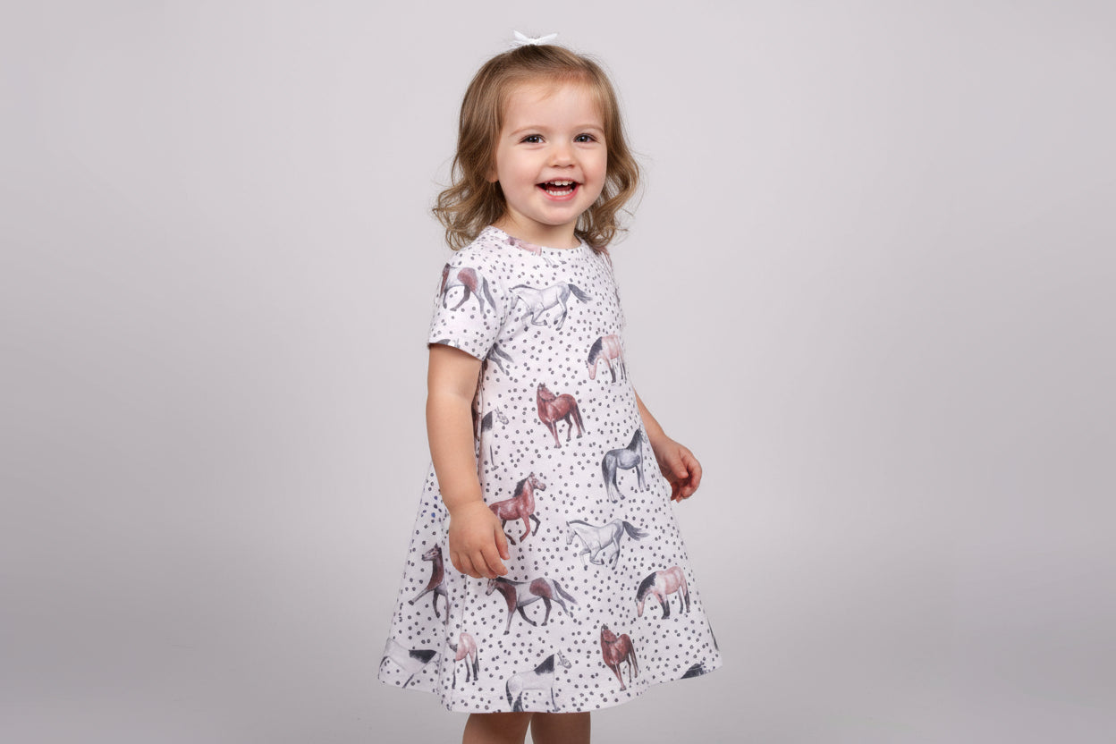 Girls' Horse Dress | Horse Girl Era | Horse Girl T-Shirt Dress 🐴✨
For the little horse lover in your life, this adorable Horses T-Shirt Dress is a must-have! 🌞 Featuring a charming horse print and a playful polka dot design, this dress is perfect for every little cowgirl who lives for all things horses!
✨ Why You’ll Love It:
✔ Versatile Style: Easy to dress up or down—pair with leggings and a jean jacket for a whole new look!
✔ Comfortable Fit: Soft cotton/spandex blend for all-day com