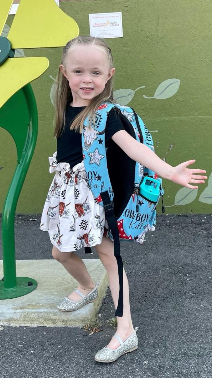 Jernie modeling Girls Cowgirl Skirt | Western Longhorn Aztec Print Skirt, Girls Paper Bag Skirt with aztec design and desert scene. Black, white and brown