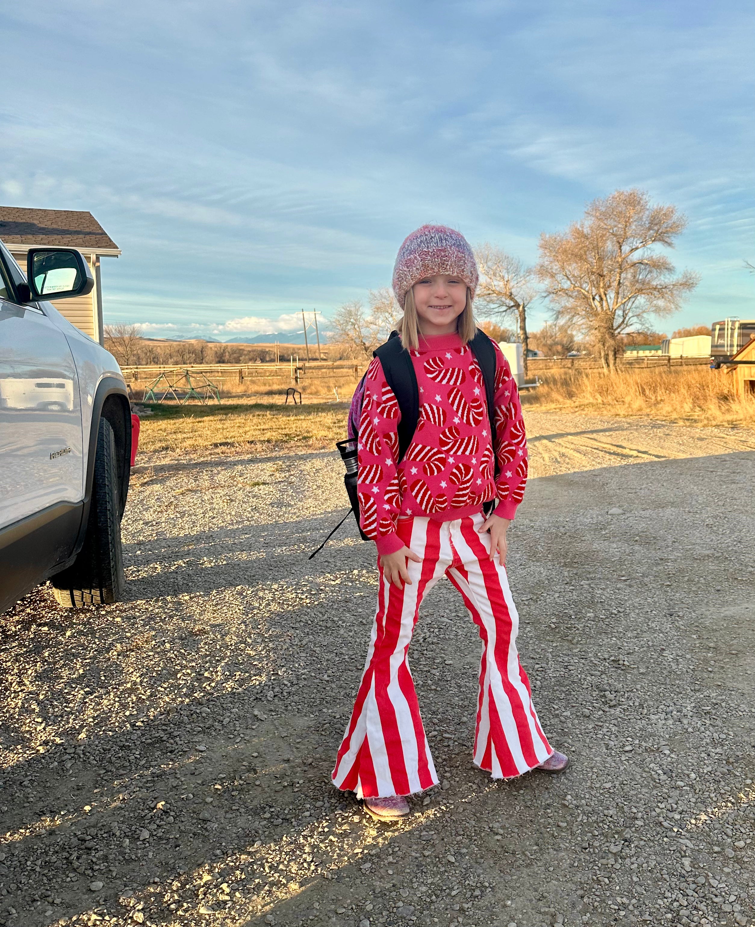 Jernie wearing Razels Red and White Striped Jeans with Candy Cane Sweater