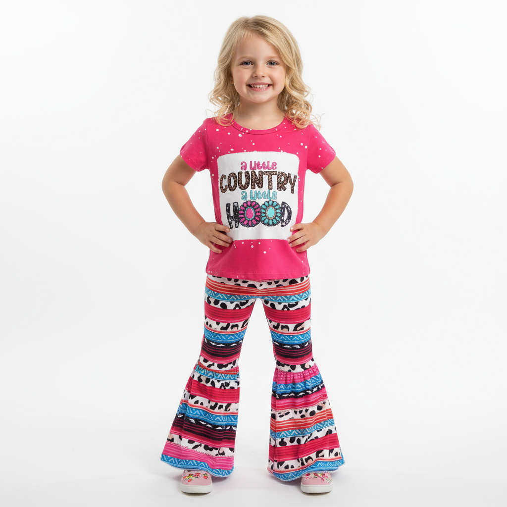 Pink t-shirt with text and colorful patterned pants on a textured white background