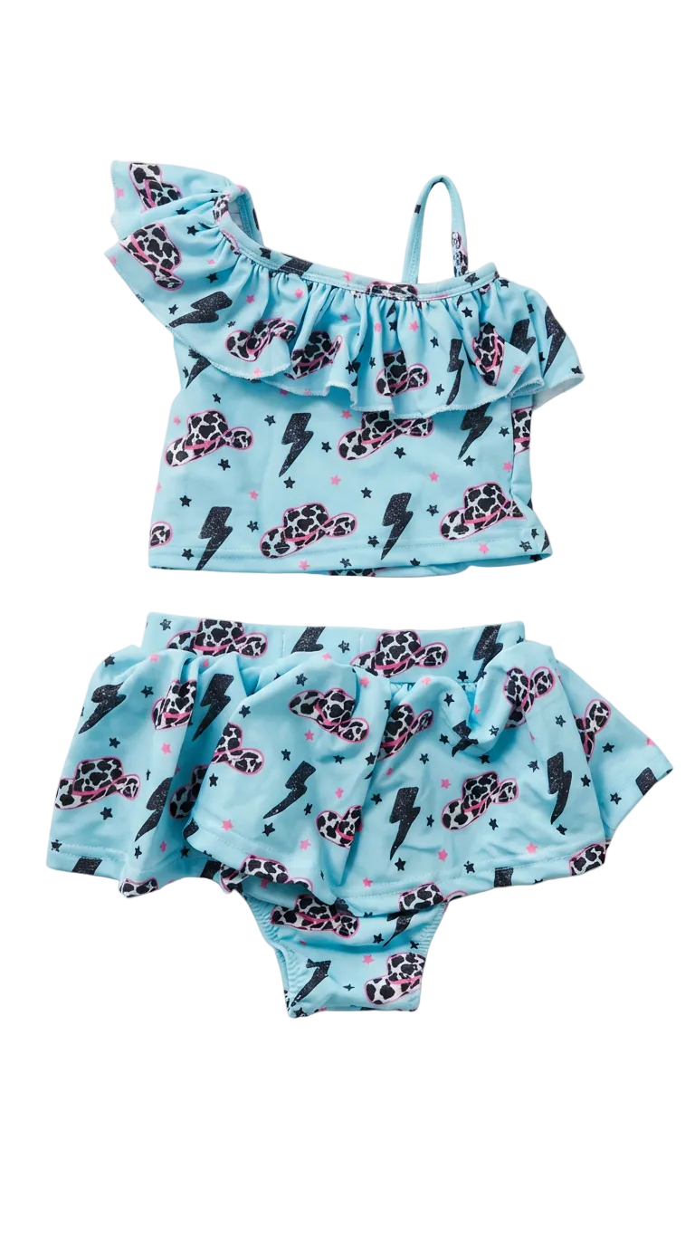 Two-piece swimsuit with black and white print cowboy hats and lightning bolt pattern on a white background
