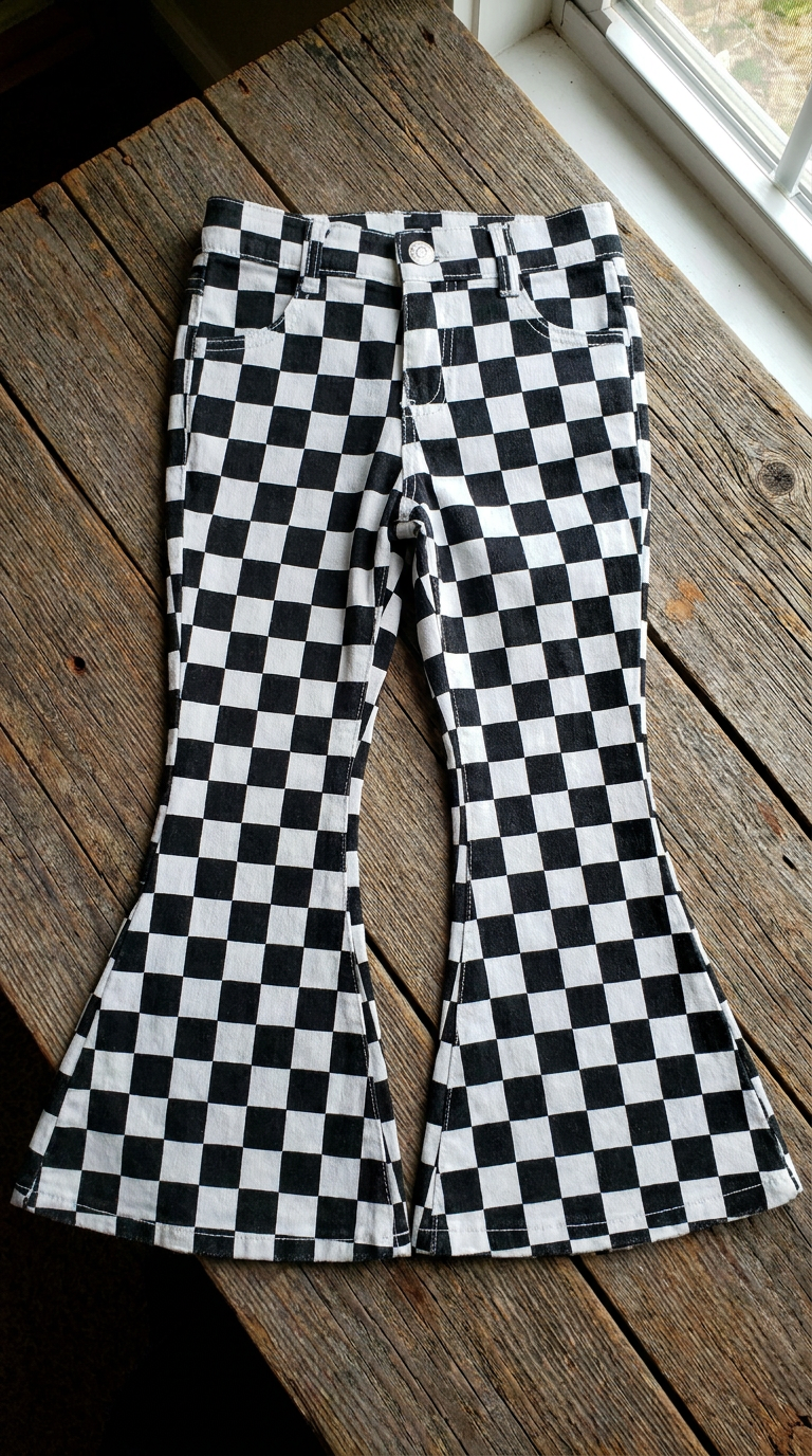flay lay front view of checkerboard pants against barnwood background