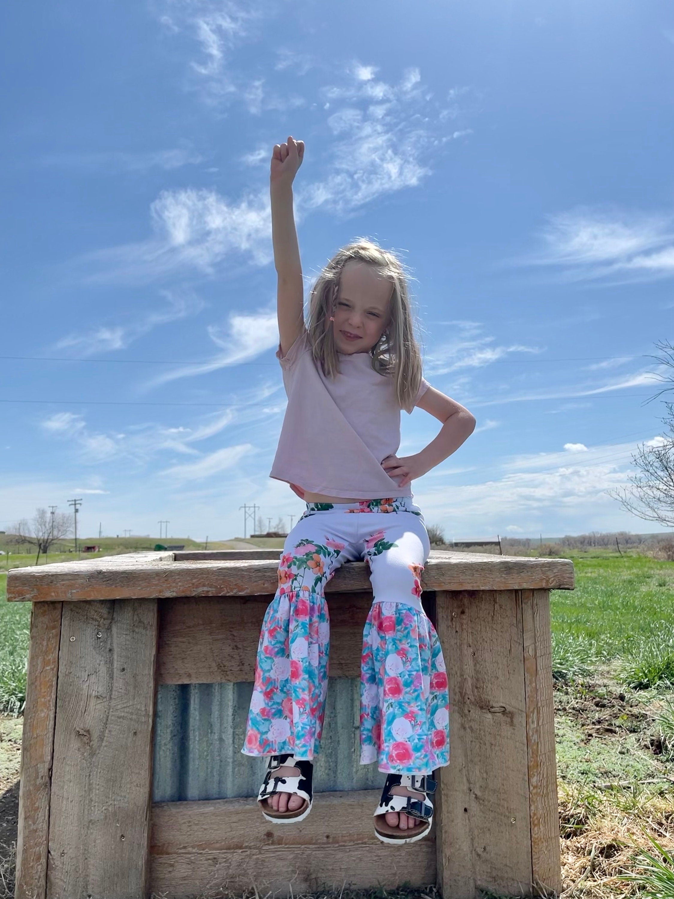 Floral Bell Bottoms designed with vibrant flower patterns and fun, playful colors are made with high-quality materials that promise comfort and durability, ensuring they’ll be a favorite all season long. These Wildflower pants will not disappoint!