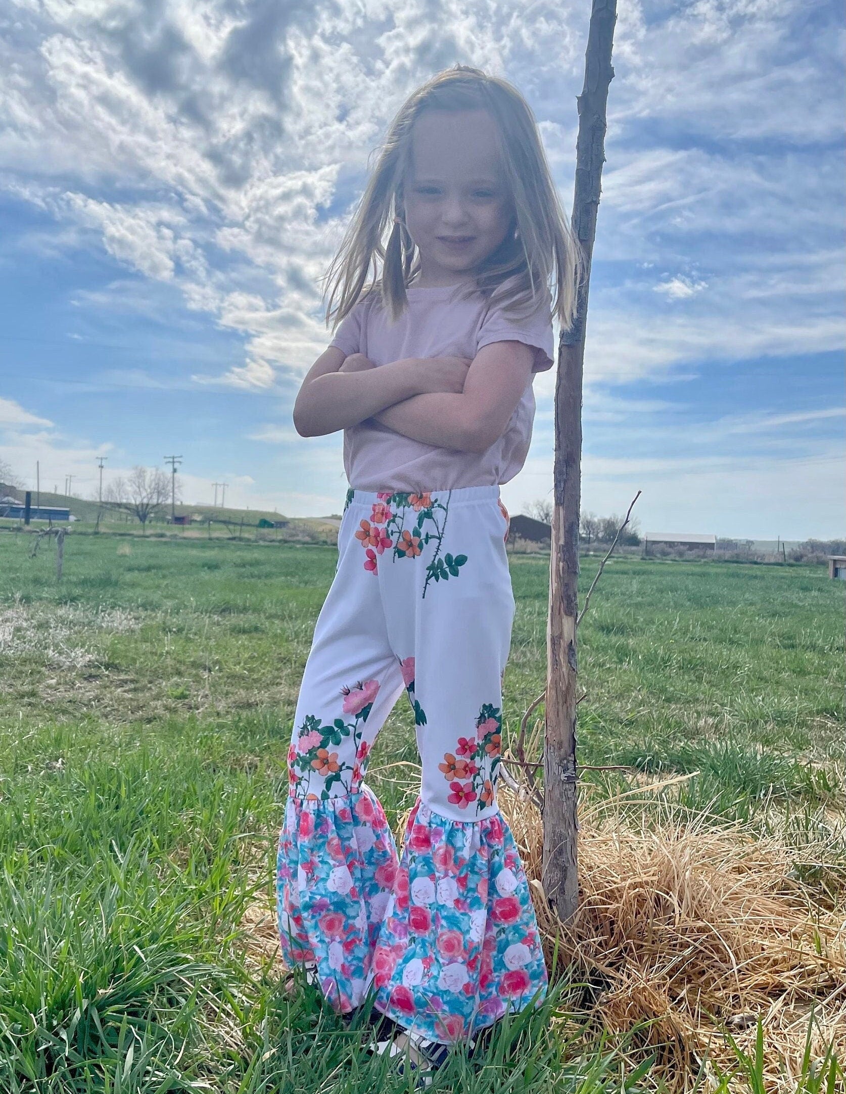 Floral Bell Bottoms designed with vibrant flower patterns and fun, playful colors are made with high-quality materials that promise comfort and durability, ensuring they’ll be a favorite all season long. These Wildflower pants will not disappoint!