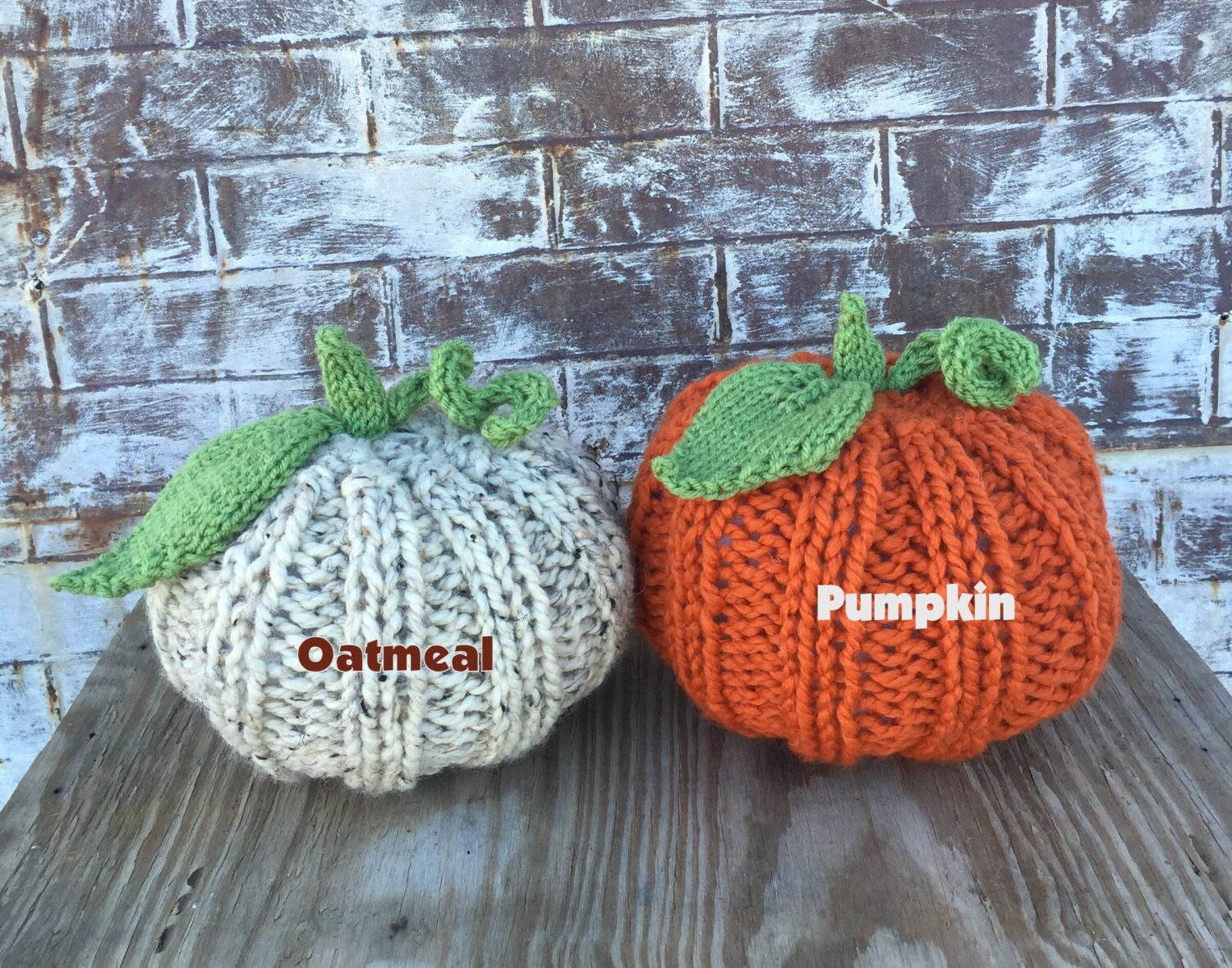 handknit large pumpkin with knit ribs along side, and a handknit leaf and vine sprouting from top! Cute! Available in Oatmeal and PUmpkin