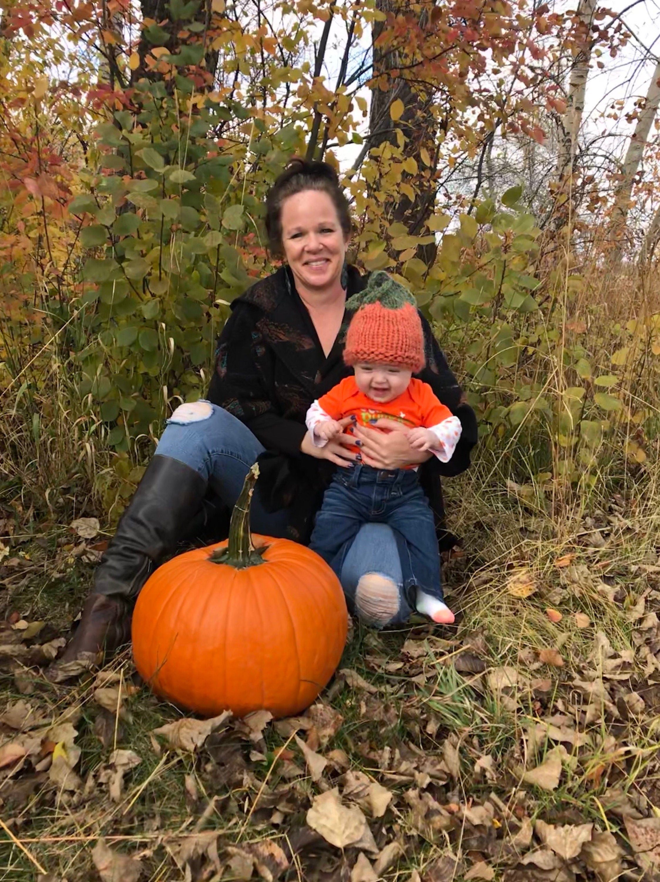 Me and Jernie with a big pumpkin and a pumpkin hat