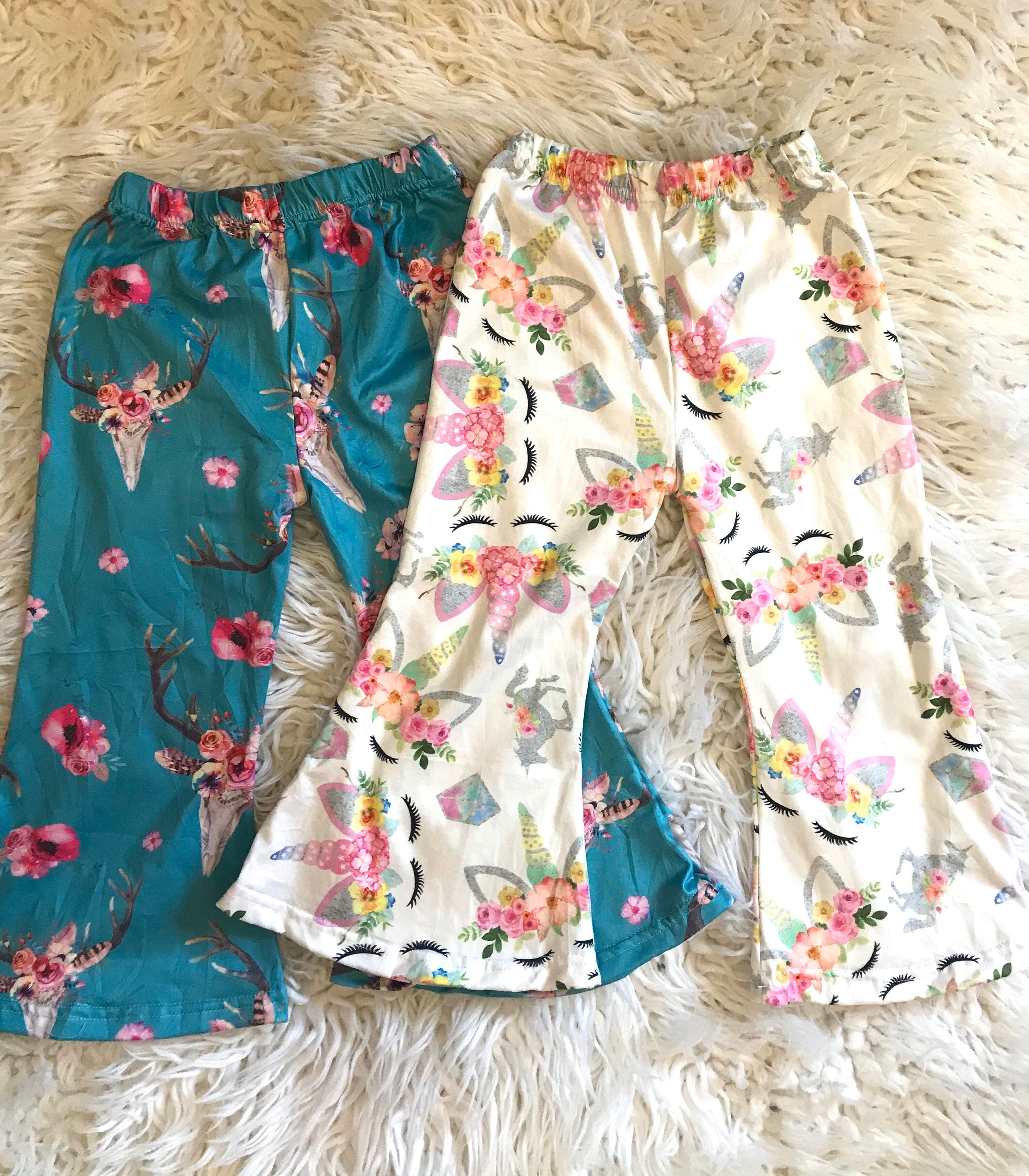 Baby & Toddler Bell Bottoms in a fun flower skull boho print! Perfectly stretchy with the ideal flare, these versatile pants are great for dressing up or down. and are machine washable! Shop Razels for more! Ships FREE with $35+ purchase