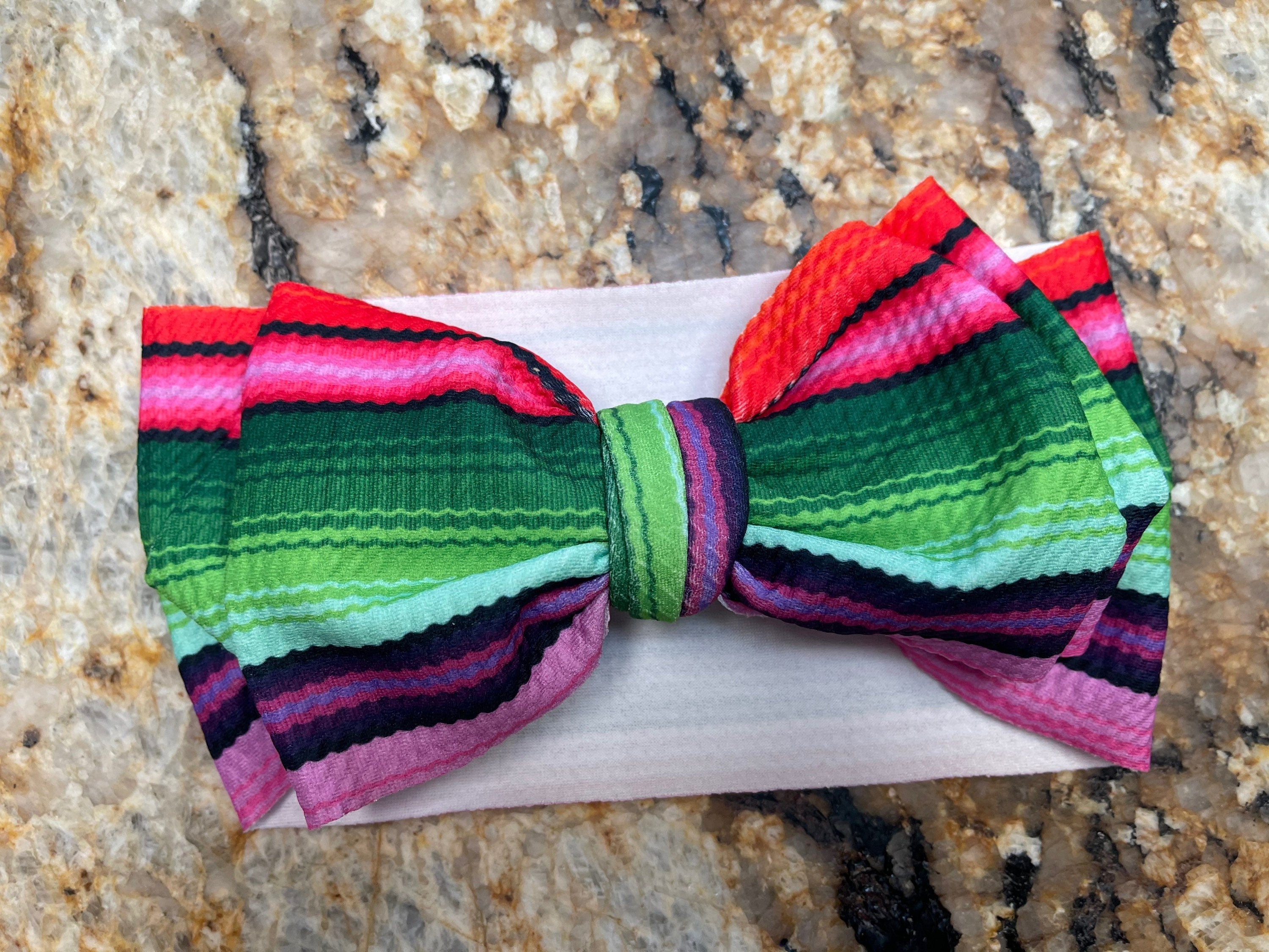 Green Multi These Big Bow Headbands for babies and toddlers are the perfect finishing touch to your little one's adorable outfit (also sold by Razels 😉). Soft, stretchy, and adjustable, they provide both comfort and style! And now, they’re available in even more colors!
✔ Hand-tied, not sewn, so you can adjust for the perfect fit