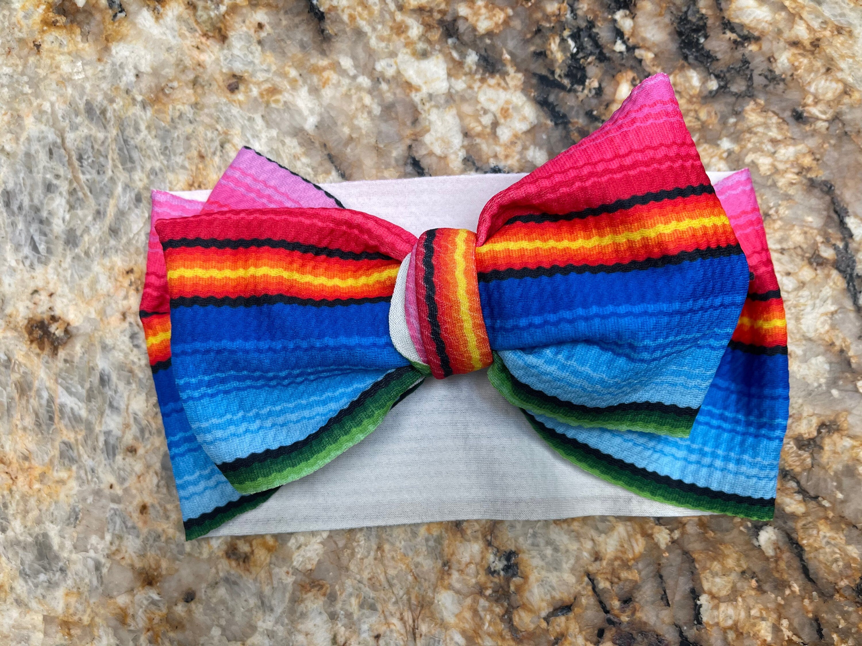 Blue Multi These Big Bow Headbands for babies and toddlers are the perfect finishing touch to your little one's adorable outfit (also sold by Razels 😉). Soft, stretchy, and adjustable, they provide both comfort and style! And now, they’re available in even more colors!
✔ Hand-tied, not sewn, so you can adjust for the perfect fit