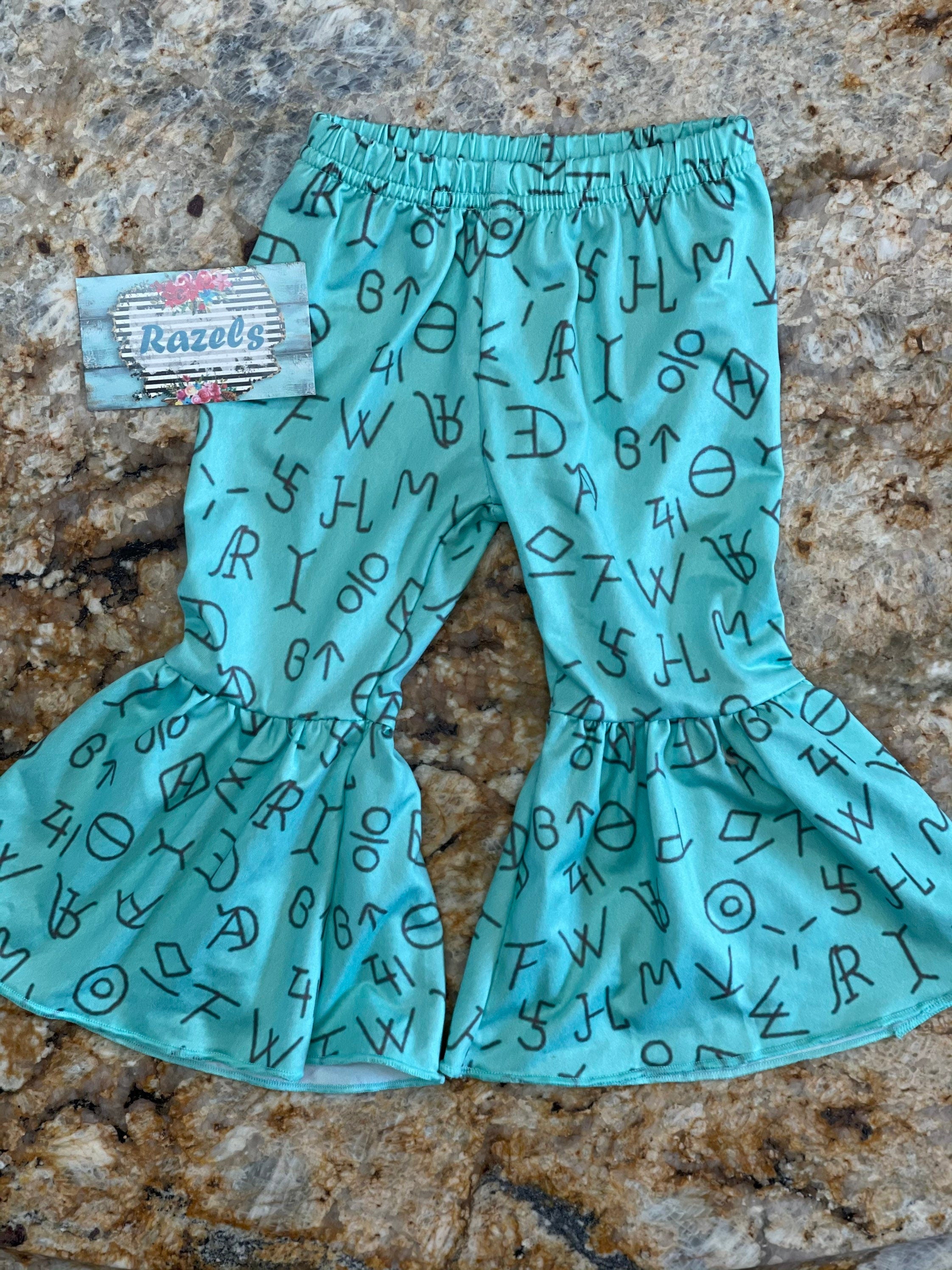 LAST ONE! 🛑 $10 CLOSEOUT – Size 3T "You Ain’t My Brand of Cattle" Bell Bottom Set | Cowgirl Outfit | Turquoise Cattle Brand Flares What a fun and sassy outfit for your little cowgirl! 🤠 This final set in size 3T includes a mustard yellow tee paired with turquoise cattle brand bell bottoms—perfect for rodeos, playdates, and everyday adventures! ✔ FINAL SALE – Only $10 plus FREE shipping from Montana on orders $35 plus!