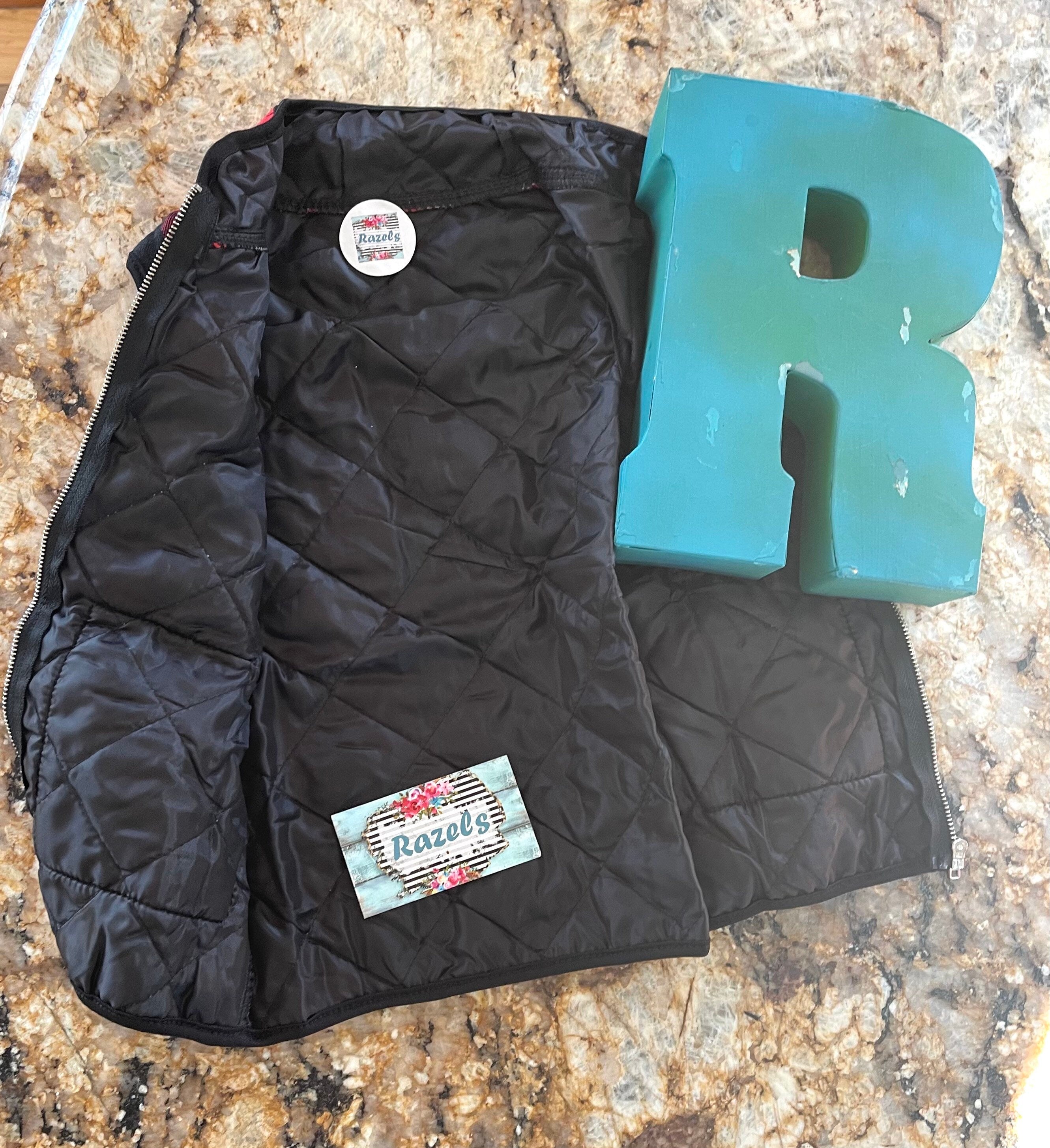 kids red and black buffalo check vest. Christmas Season Vest features a quilted design, zipper and two front pockets.