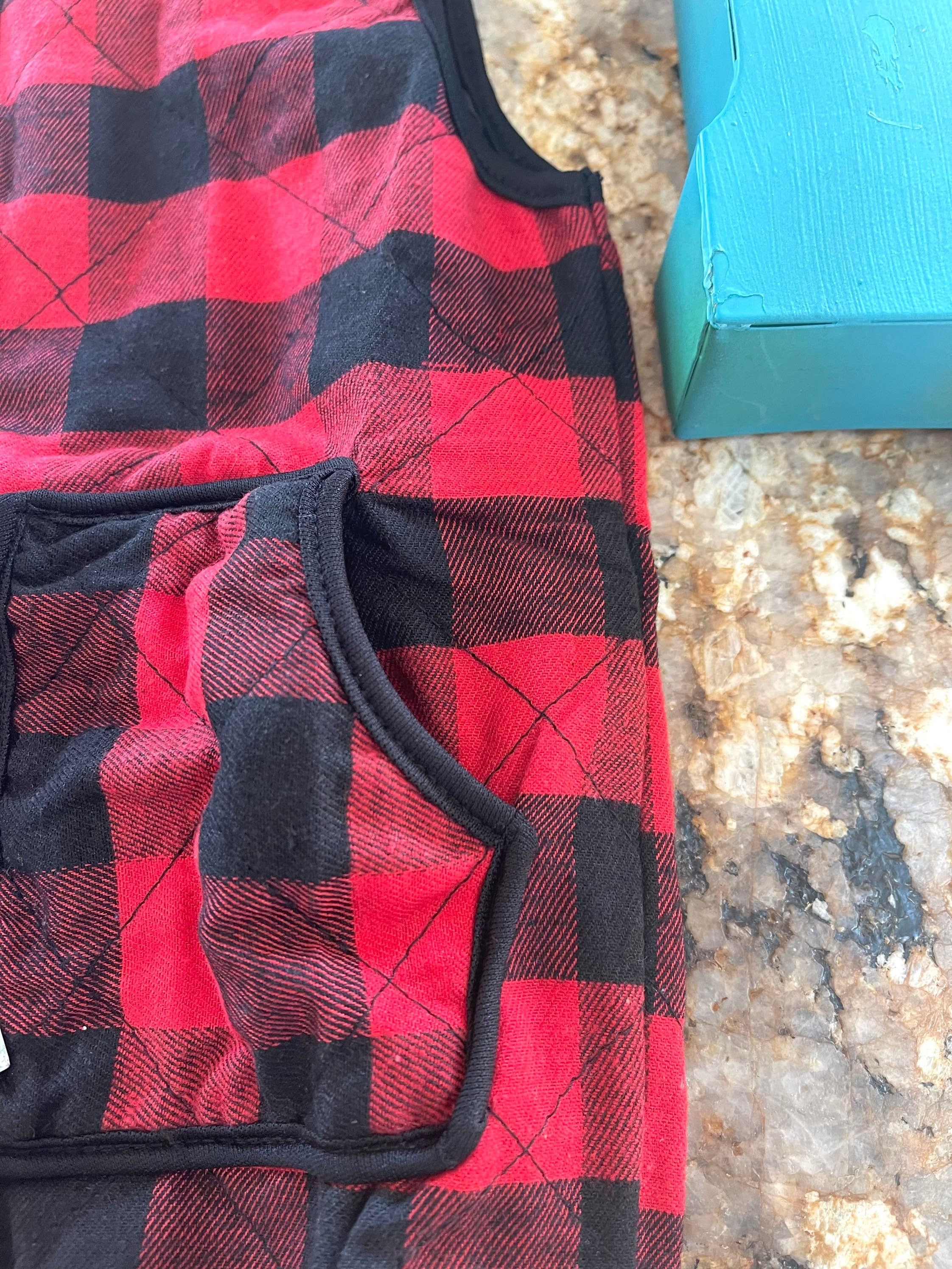 kids red and black buffalo check vest. Christmas Season Vest features a quilted design, zipper and two front pockets.