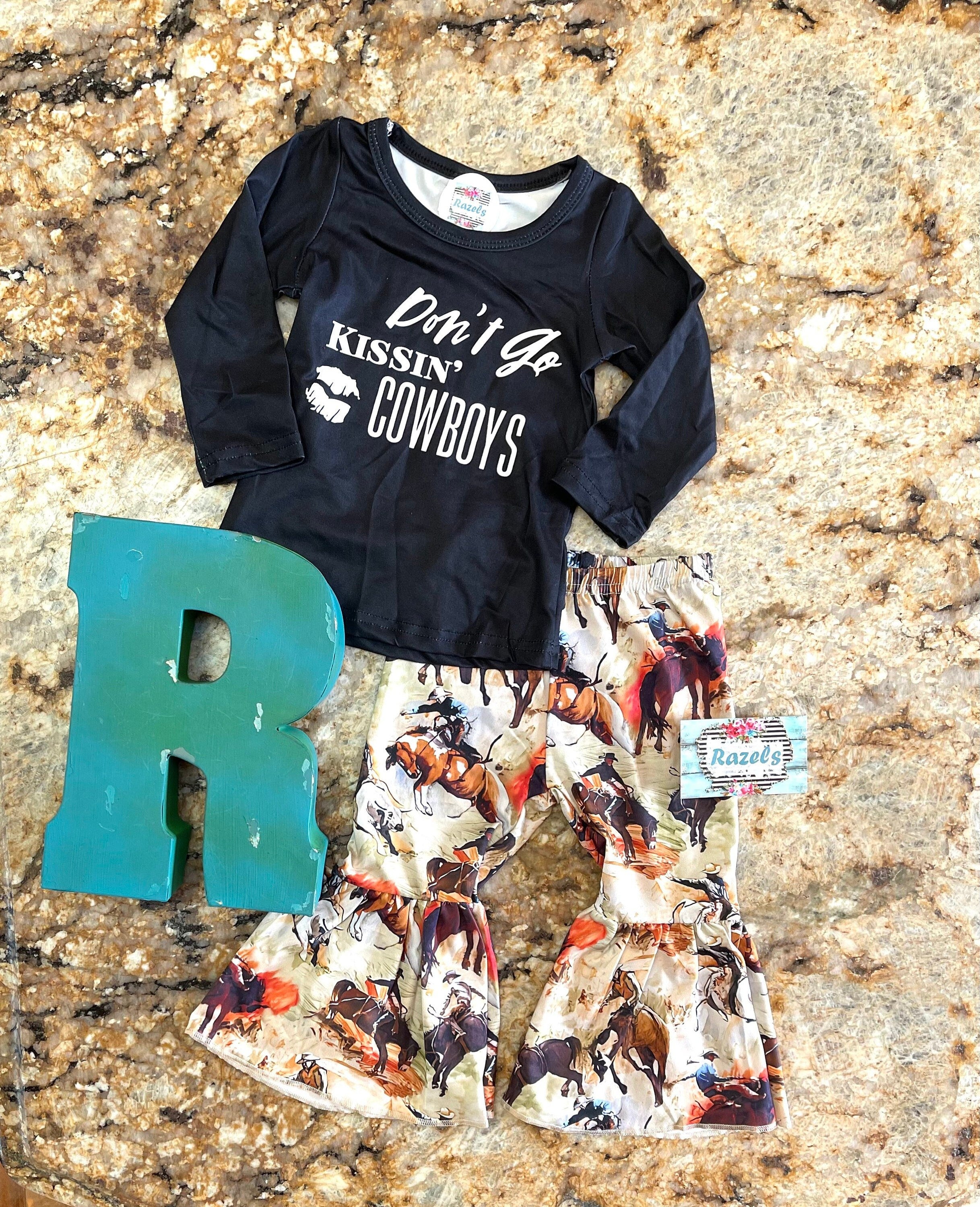 🌵 LAST ONE! SIZE 7/8 – ONLY $10 CLOSEOUT PRICE
Don’t Go Kissing Cowboys Bell Bottoms | Cowboy Rodeo Flare Pants
A fun and sassy outfit for our little cowgirls (and a good reminder for the rest of us!) 🤠💋 These Cowboy Rodeo Flare Pants bring the perfect mix of Western charm and trendy style!
🚨 Only ONE left in size 7/8! Grab it before it's gone! Shop Razels for more Western boutique outfits! FREE U.S. shipping on orders of $35+!