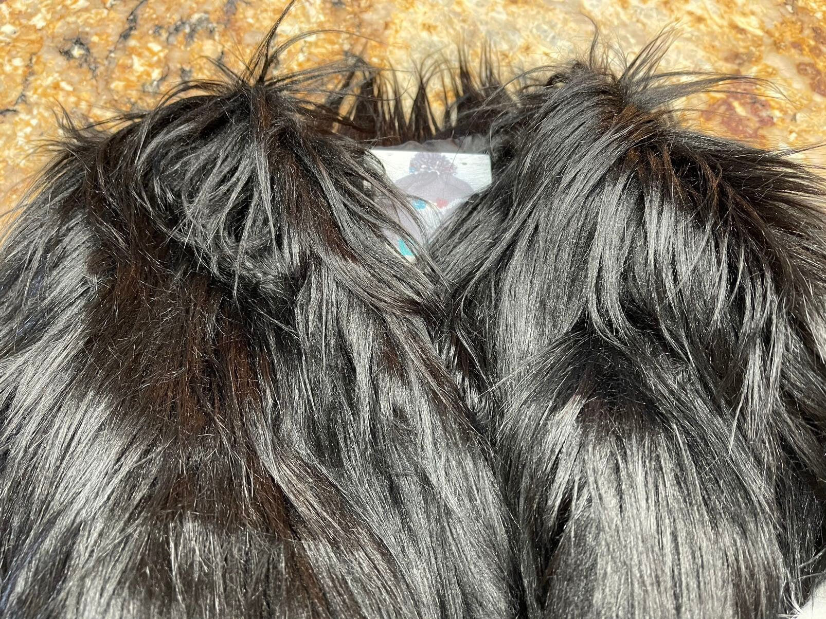Girls fur coat features a fabulous shaggy fur exterior, silky smooth lining, and convenient eye and hook closures. She’ll feel and look like a princess in this stunning coat from Razels.