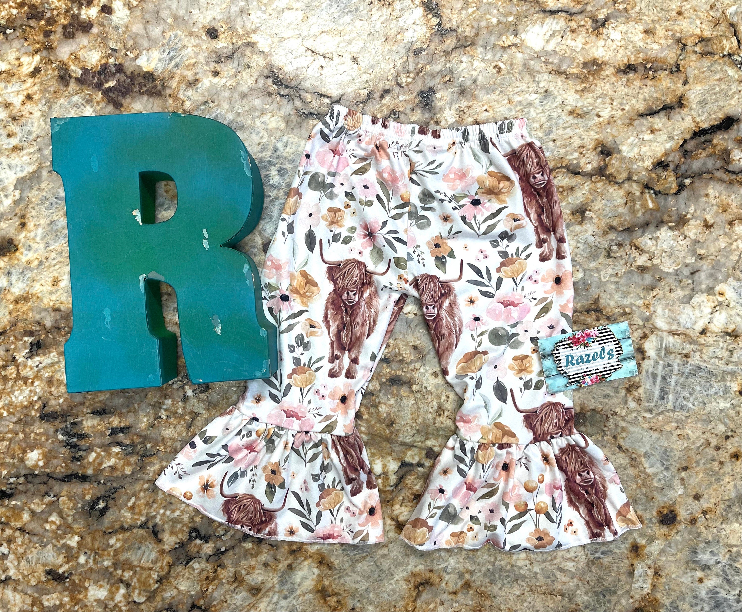 Highland Cow Floral Bell Bottoms – Adorable Western Cow Pants for Little Cowgirls! Featuring a whimsical design of Highland cows and florals, these Western bell bottoms have a soft, stretchy fit and a fabulous flare! Comfortable and Cute!