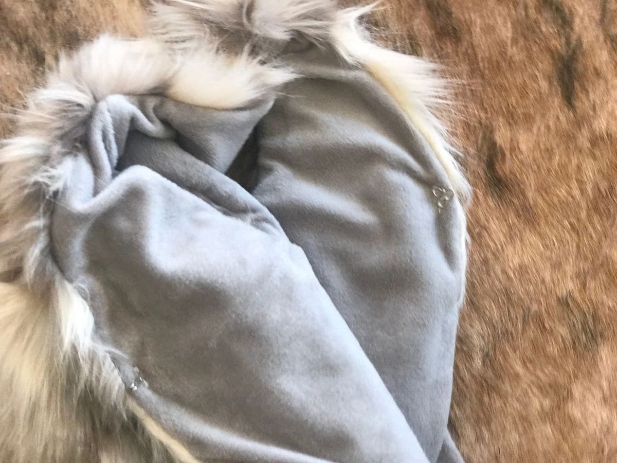 Cozy and stylish Kids' Fur Vest in a blend of grey, black, brown, and cream. Perfect for layering over any outfit, this well-made vest keeps your child warm and photo-ready. The versatile colors make it easy to mix and match with her wardrobe.