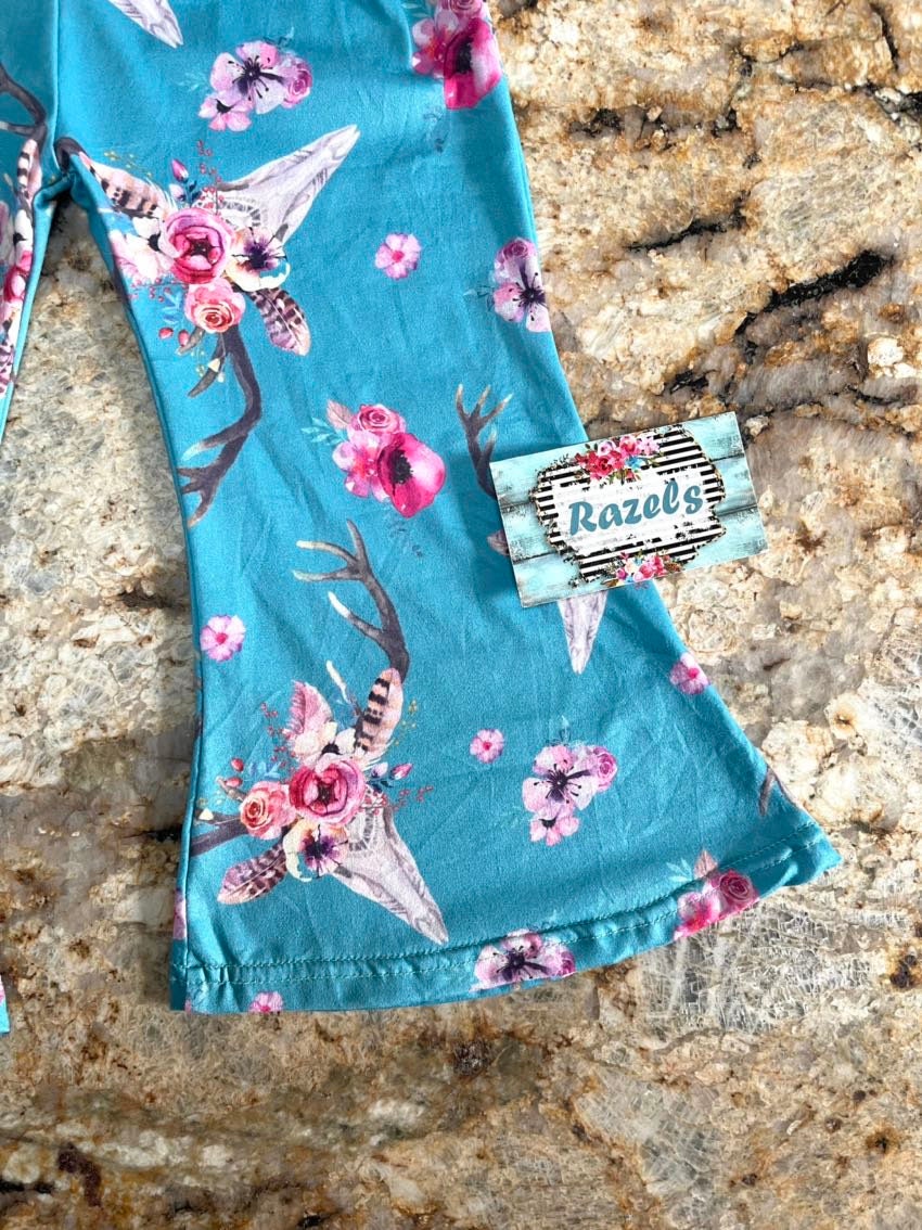 Baby & Toddler Bell Bottoms in a fun flower skull boho print! Perfectly stretchy with the ideal flare, these versatile pants are great for dressing up or down. and are machine washable! Shop Razels for more! Ships FREE with $35+ purchase