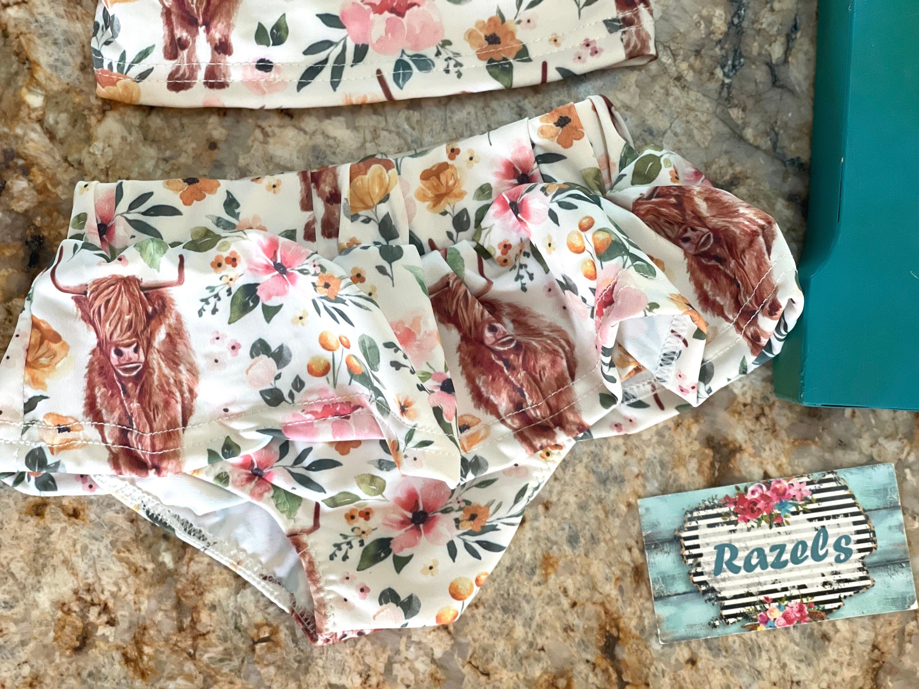 Highland Cow Swimsuit – The Sweetest Western Tankini! 🐂💖
Calling all Highland Cow lovers! This adorable Highland Cow Swimsuit features the funnest (yes, that's a word for this cuteness!) Scottish Highlander Cows and Flowers in a stylish tankini design. With a ruffled neckline and a skirted bottom, this Cowgirl Swimsuit for Kids is as sweet as it is fun! 🌸🐂
✔ Available Sizes: 0-3 months to 8/9!