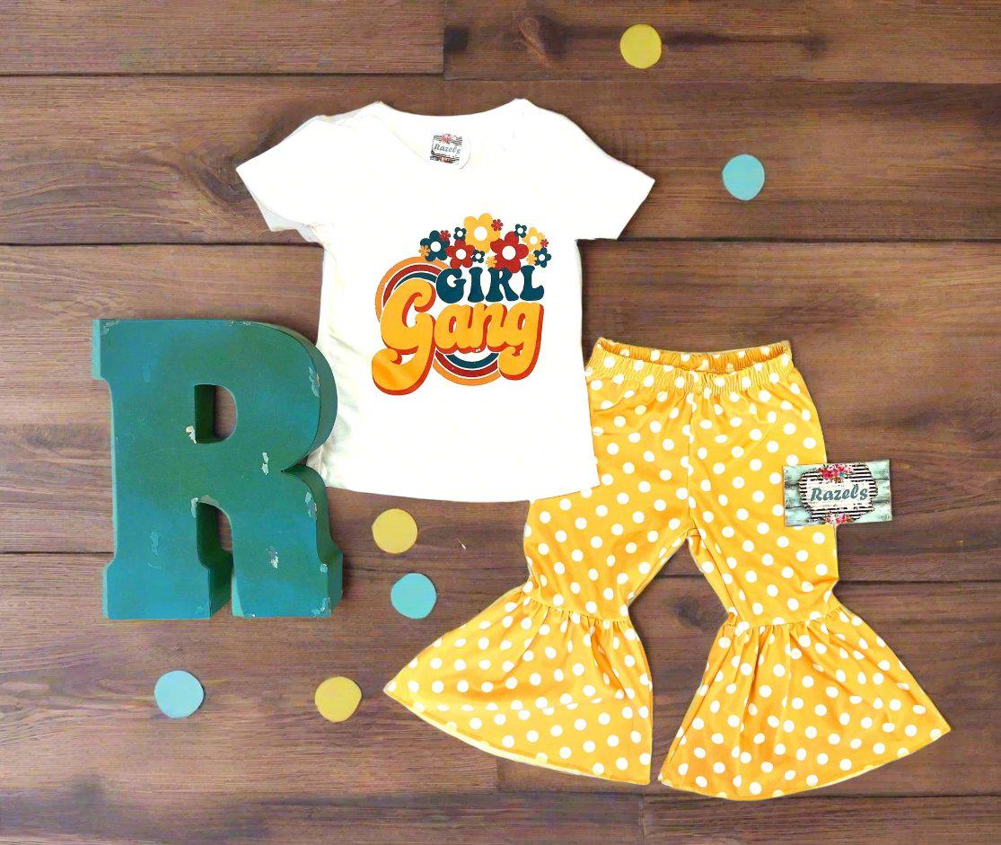 Girl Gang Shirt and Yellow Polka Dot Bell Bottom Outfit – Retro Floral Vibes for Girls! 🌼💪🏽
This fun, bright Polka Dot Bell Bottom outfit is perfect for your little fashionista! I love the retro floral vibe, and what could be more fun than yellow polka dot bell bottoms? This adorable outfit is ready for sunshine and warm weather! 🌞 Or, pair it with a denim jacket for those cooler days, especially if you live in Montana like us! 😉🤠Ships FREE with $35+ purchase from MONTANA.