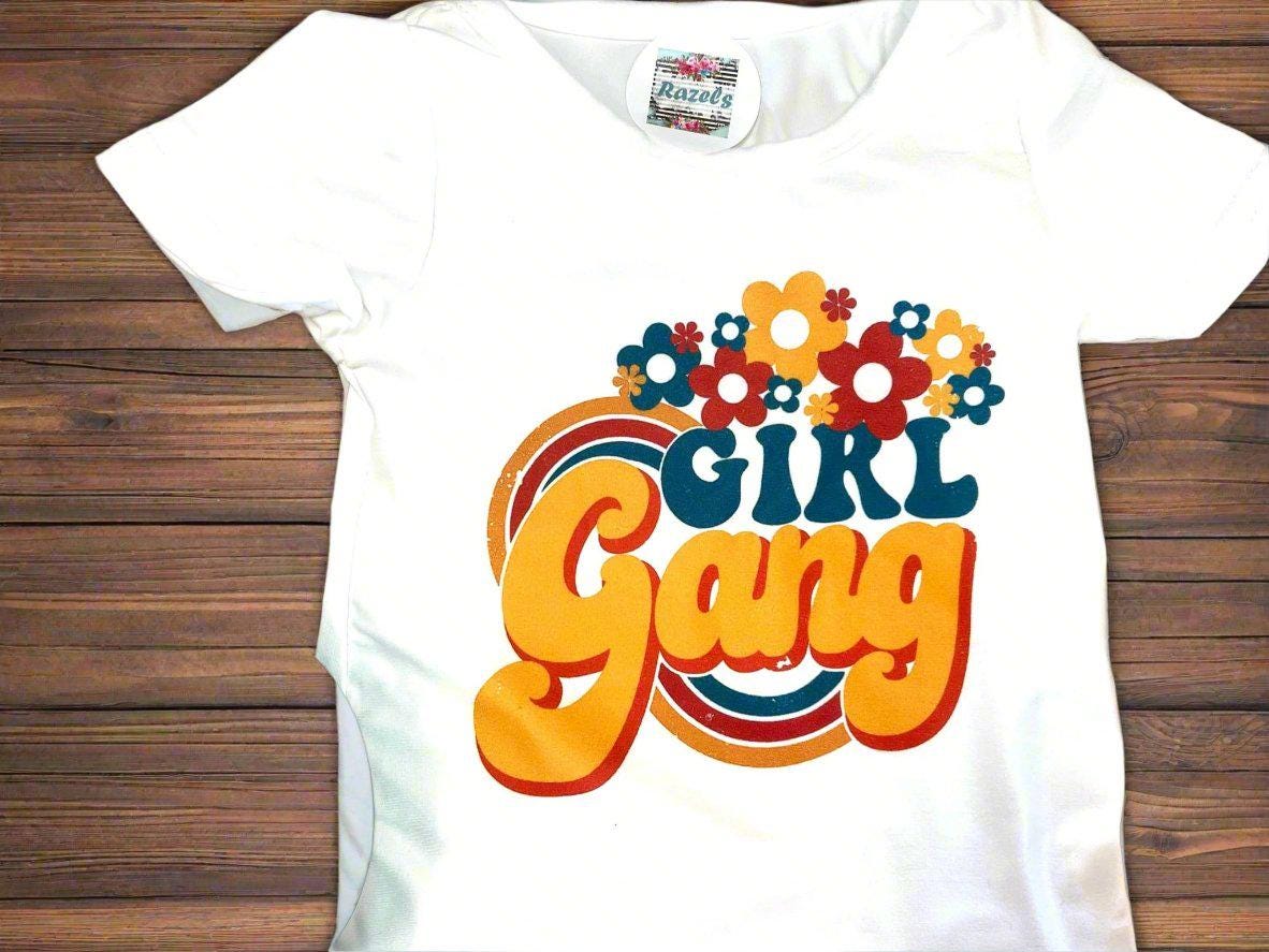 Girl Gang Shirt and Yellow Polka Dot Bell Bottom Outfit – Retro Floral Vibes for Girls! 🌼💪🏽
This fun, bright Polka Dot Bell Bottom outfit is perfect for your little fashionista! I love the retro floral vibe, and what could be more fun than yellow polka dot bell bottoms? This adorable outfit is ready for sunshine and warm weather! 🌞 Or, pair it with a denim jacket for those cooler days, especially if you live in Montana like us! 😉🤠Ships FREE with $35+ purchase from MONTANA.