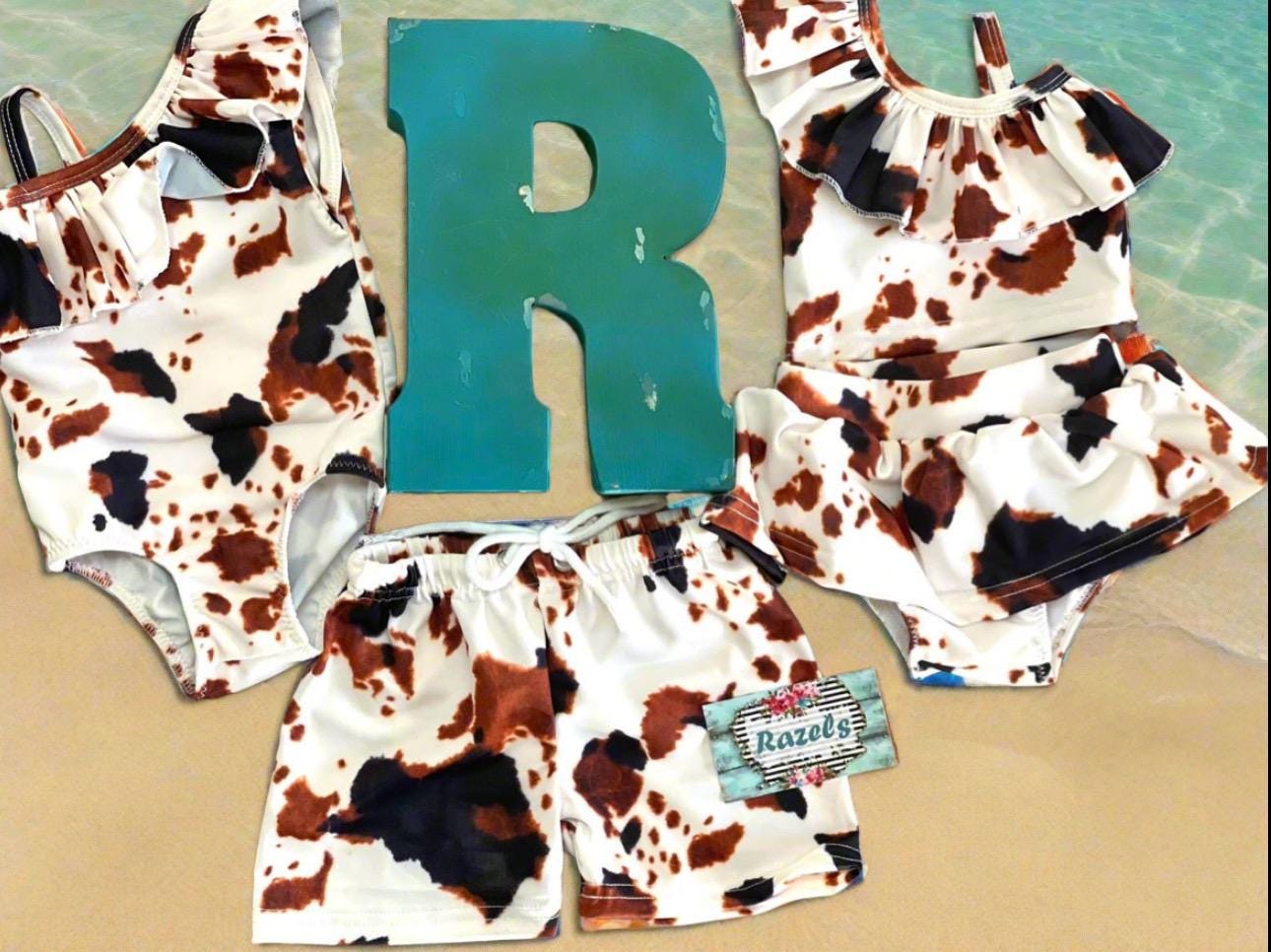 Cow Print Swim Suits are perfect for little cowboys and cowgirls! Available Styles: Cow Print One-Piece, 2-piece tankini, or boys' Cowprint Shorts.Available in sizes 0-3 months to 8/9 years. Ship FREE with $35+ purchase.