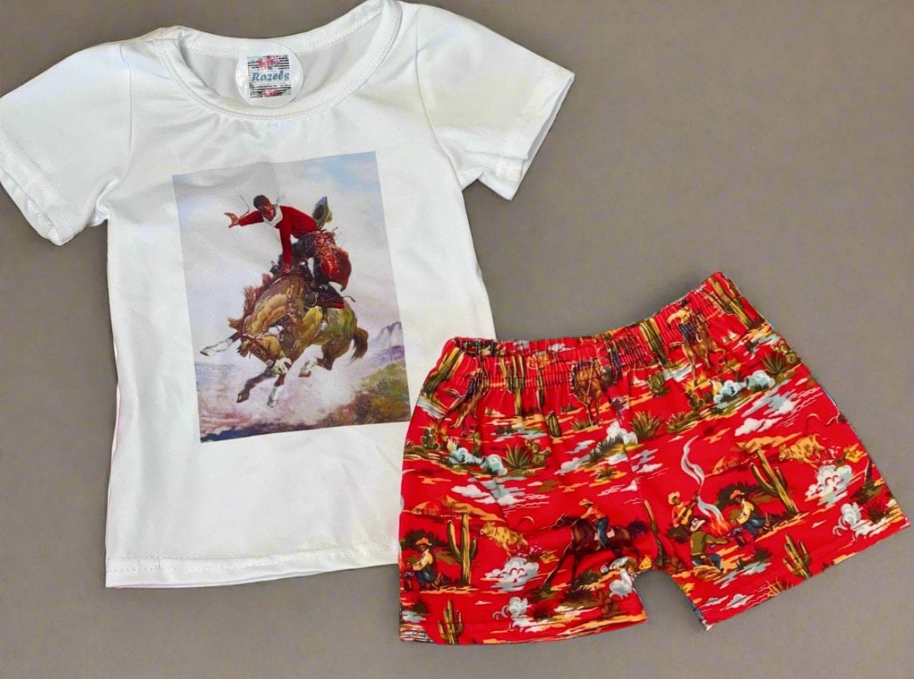 Saddle up in style with this adorable Girls’ Cowgirl Outfit! This Retro Western Short Set is perfect for summer rodeos, playdates, or just lounging in comfort. The set includes a stylish Rodeo Shirt featuring a bold bronc rider graphic and matching Cowboy Shorts with a fun vintage-inspired Western Shorts design. ✨ Matching Mom and Daughter Set Available – Twinning Approved! ✨ Soft, Breathable & Stretchy (95% Cotton, 5% Spandex) ✨ True to Size (TTS) for the Perfect Fit