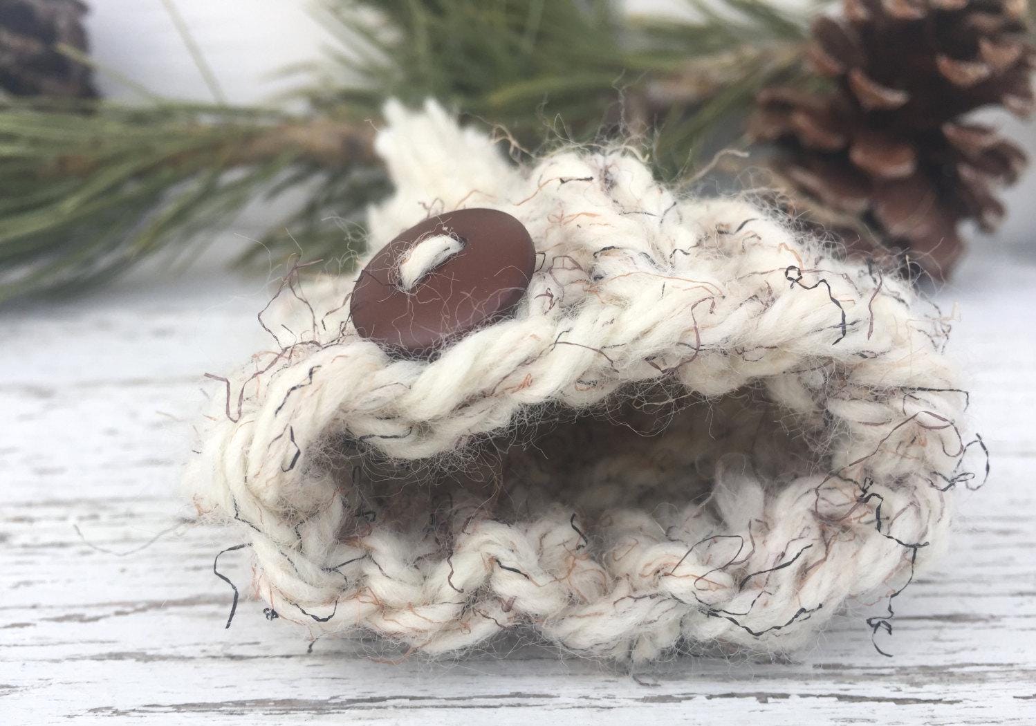 Handknit Mini Hat Christmas Tree Ornament. This hat is a white with black and brown flecks and a brown button centered on the brim. Hat also has an adorable, matching pom pom.