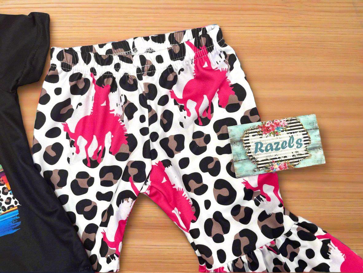 Cowgirl Bell Bottom Outfit featuring Pink Bronc Rider silhouettes and bold animal print! Perfect for rodeo fans and little ones who love a touch of Western flair, this Girls Bell Bottom Set is both stylish and fun. Ships FREE with $35+ order