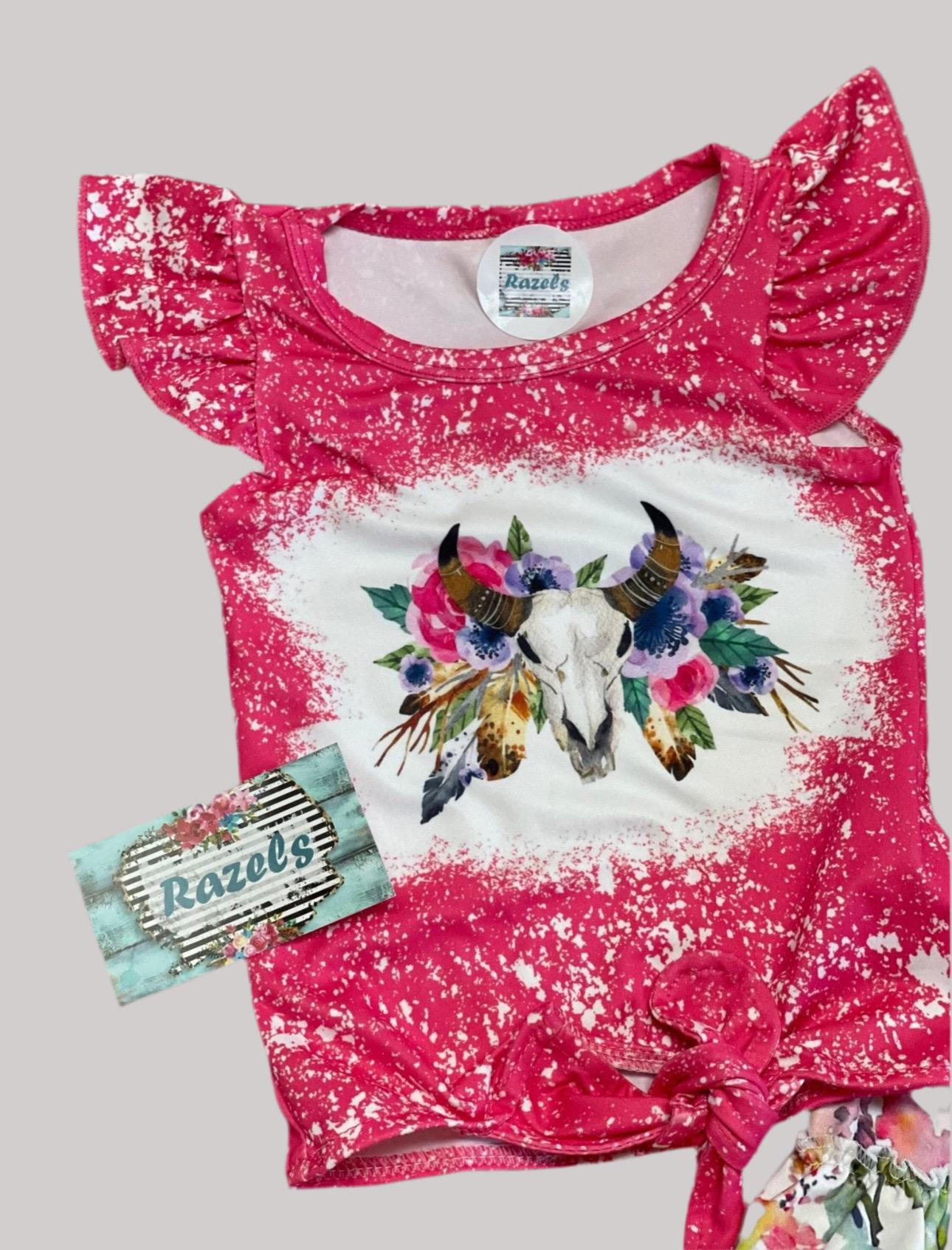 This Cowgirl BOHO Short Set is sweet, sassy, and full of Western charm — perfect for your little rodeo princess! The soft bleach-splattered ruffle sleeve tee features a bold cow skull with colorful flowers, a trendy tie-front hem, and boutique-quality detailing. Paired with matching ruffle shorts in a beautiful all-over floral print, this outfit is made for both style and play.
✓ Adorable Western boho design for girls, toddlers, and babies