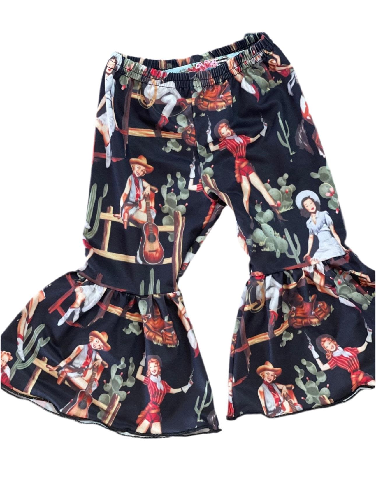 Let’s Go Girls Bell Bottom Outfit or Short Set – A Fun and Stylish Look for Little Cowgirls! 🤠😍
Get your little cowgirl ready for any occasion with this adorable Let’s Go Girls t-shirt and vintage cowgirl bell bottom pants or short set