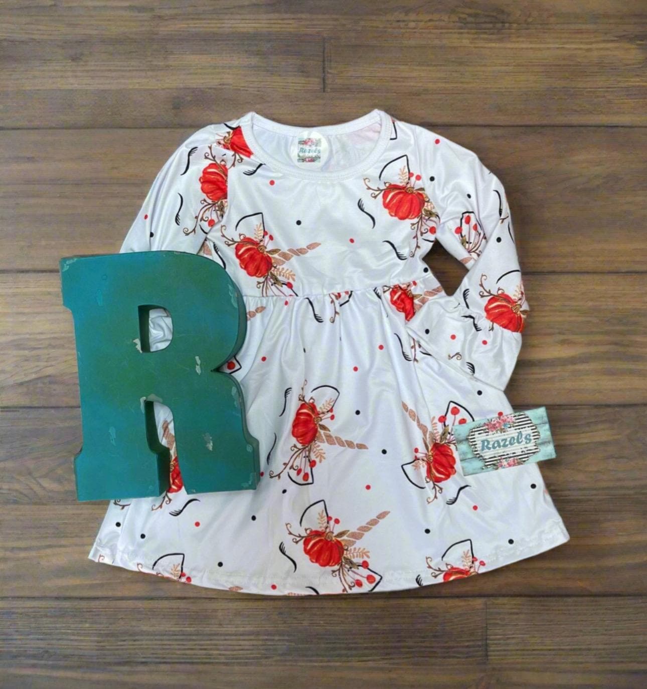 Adorable Pumpkin Unicorn print dress and romper for fall! Romper has split shoulders and leg snaps for easy changes, while the dress features flutter sleeves. Made from a soft, stretchy cotton blend for comfort all season. Think Fall photoshoots!