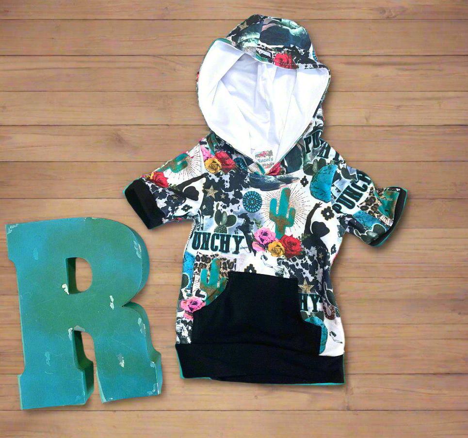 Girls Cowgirl Outfit | Western Hoodie Jogger Set for Kids This Girls PUNCHY Cowgirl Outfit is full of retro cowboy vibes. This Western outfit features an allover Western print with matching jogger pants and a lightweight, short-sleeved hoodie top.