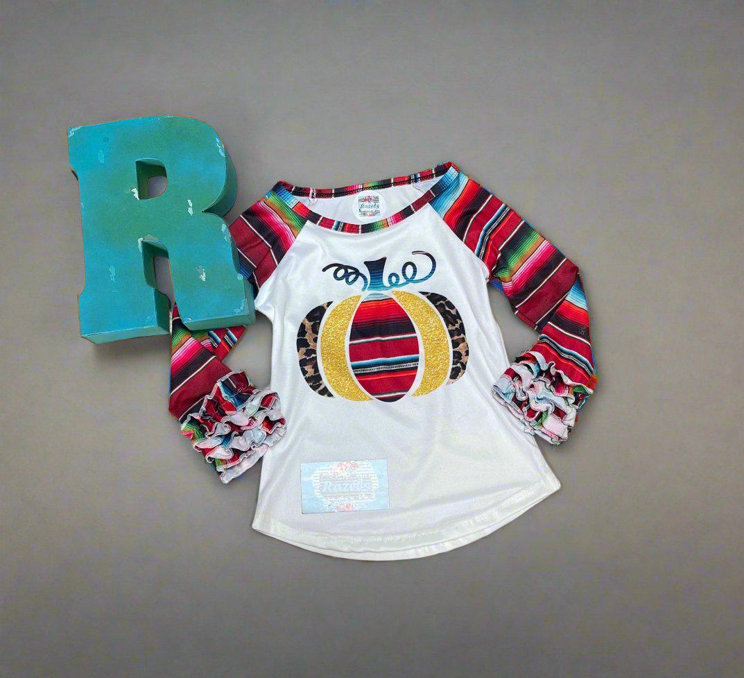 Fall Stripes Pumpkin Ruffle Sleeve Shirt. This Fall Shirt features a pumpkin with Fall serape stripes, cheetah print and glitter gold. The neckline and sleeves are festive serape stripes with wrist ruffles. So cute!