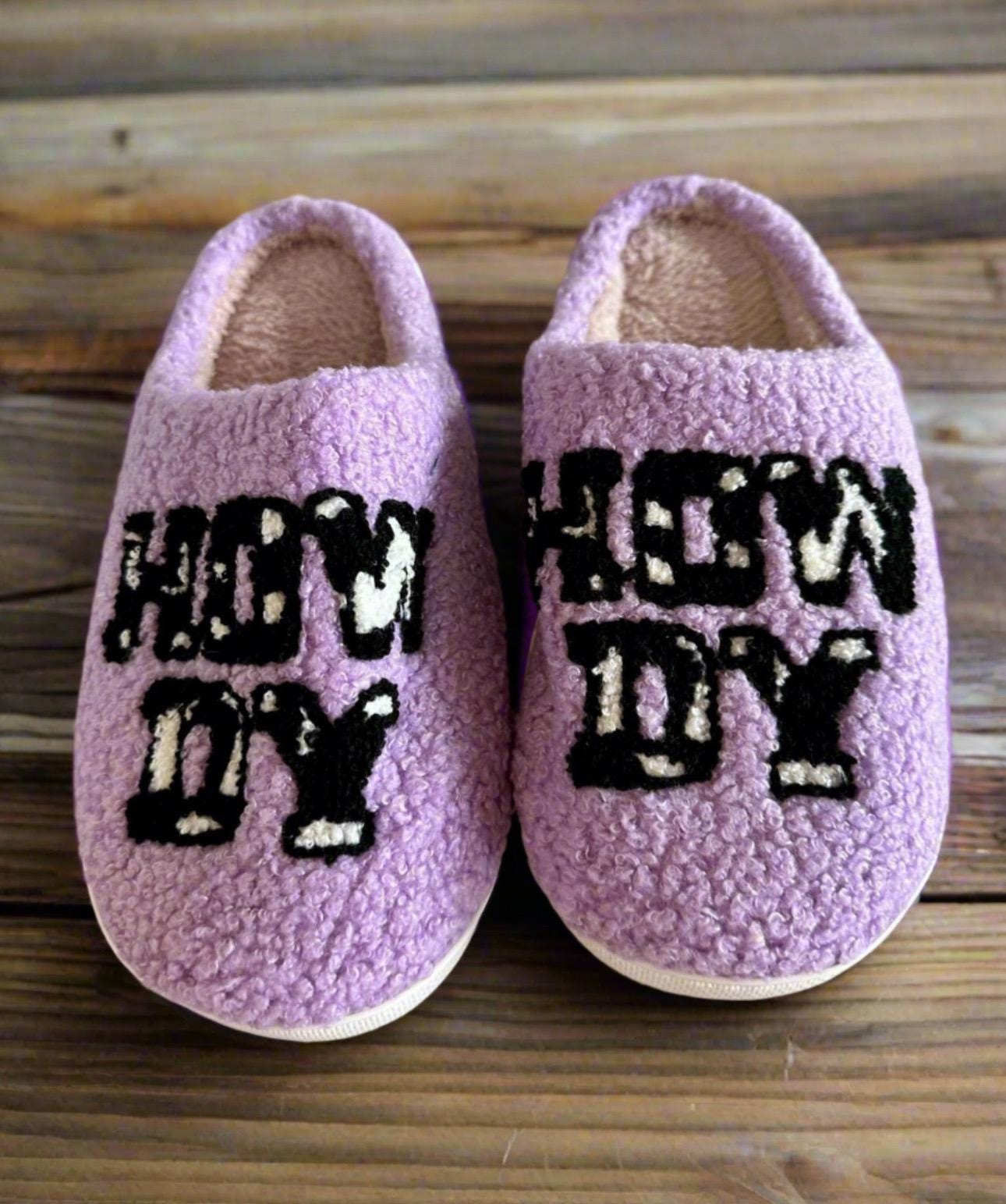 Howdy Cowgirl! The Perfect Valentineās Gift ā Introducing Purple Howdy Slippers šWith their bold purple color, playful cowprint, and cheerful "Howdy" design, these slippers are the perfect blend of style and comfort. Ships FREE with $35 purchase