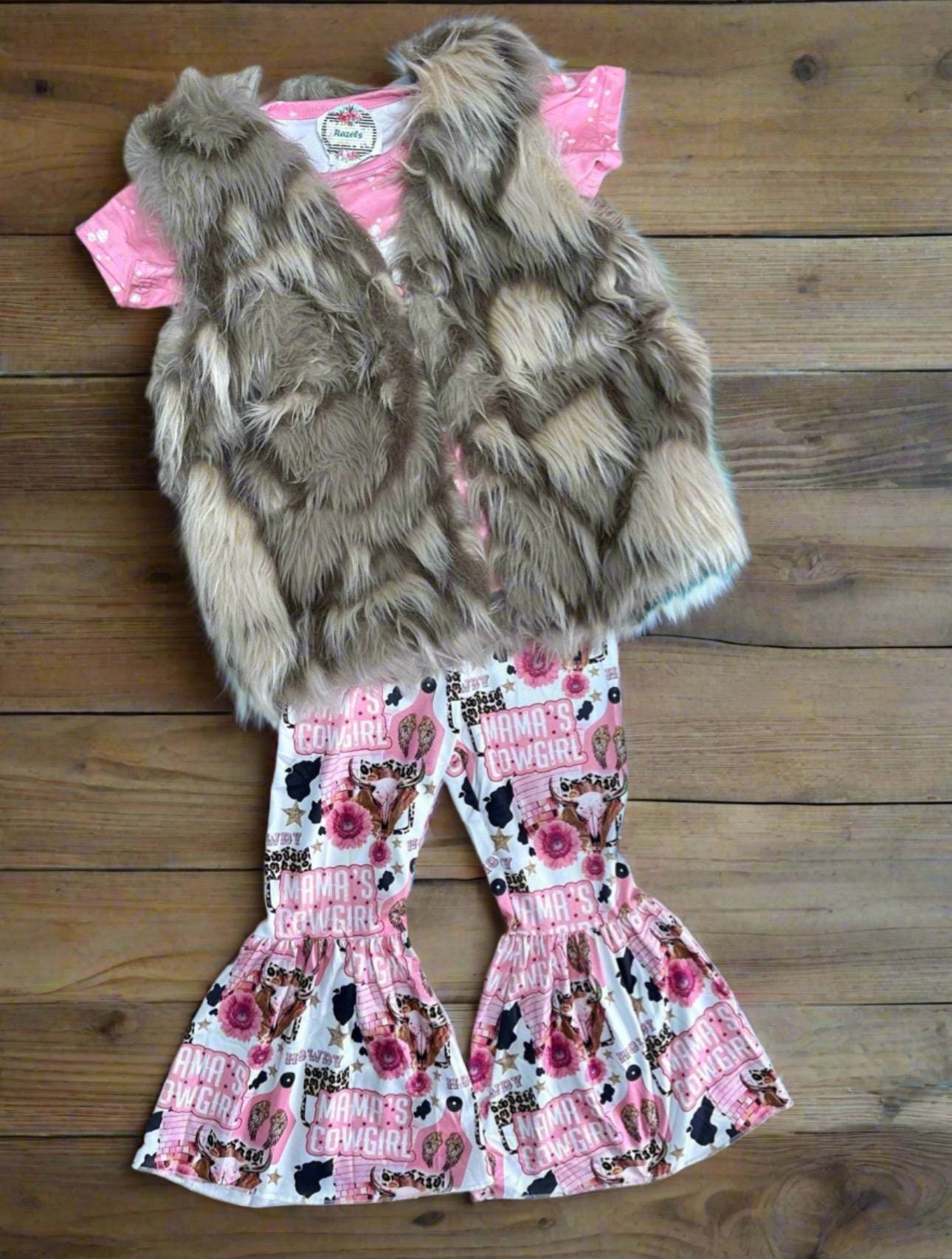 Mama’s Cowgirl Bell Bottom Outfit features a pink bleach-splattered tee with Mama's Cowgirl on the front and the bell bottom pants feature the funnest cowgirl motif with cheetah rodeo back numbers, disco balls, cow skulls, cowprint, and gold stars!