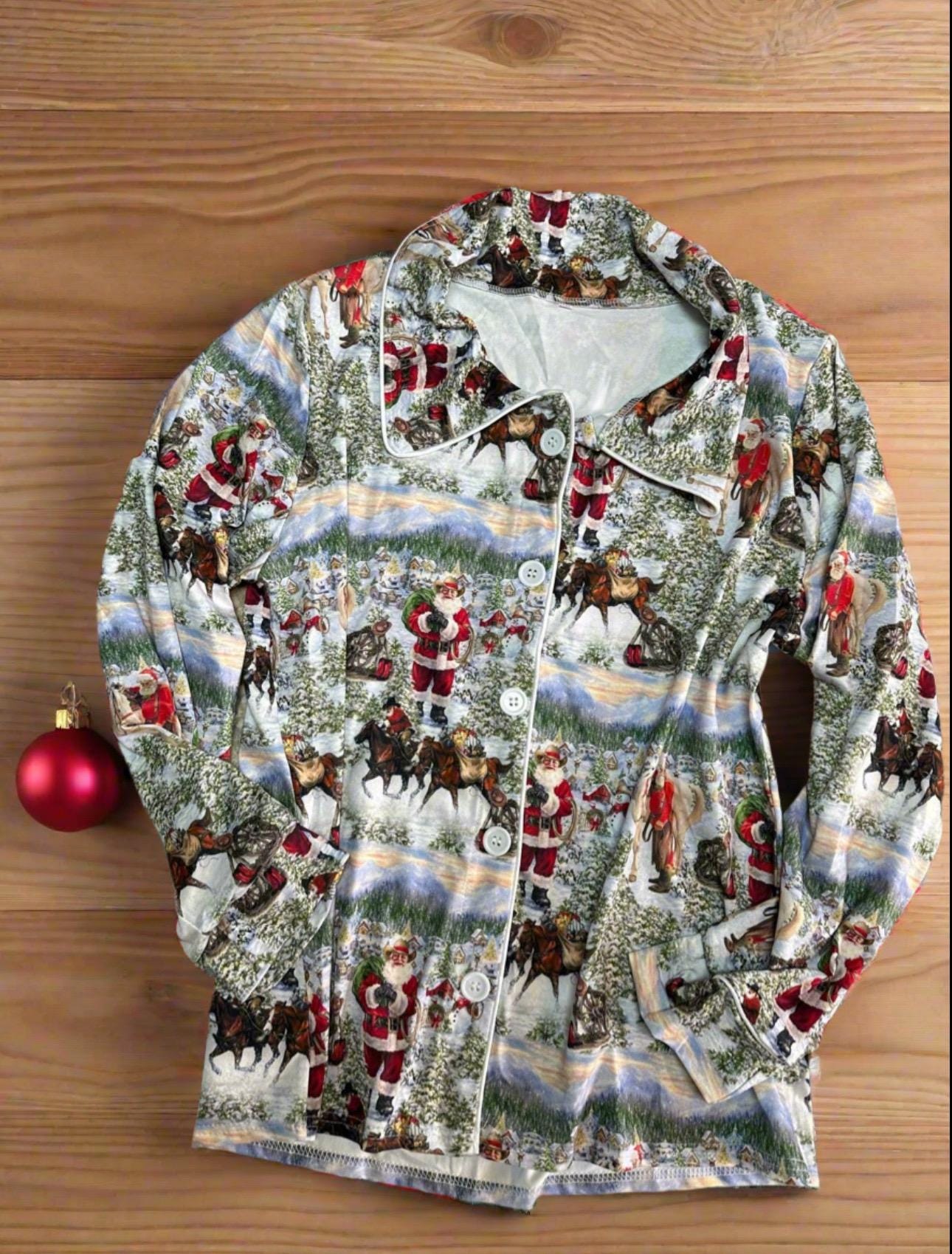 ORIGINAL Cowboy Santa Pajamas featuring Western Santa and his best horses. This button-down pajama style is perfect for the whole family.
