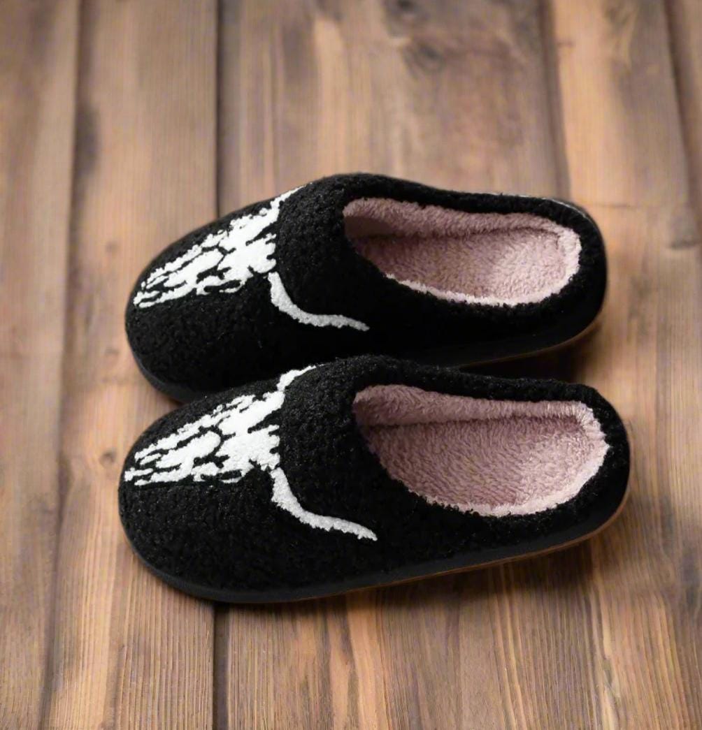 Longhorn Skull Slippers have a comfy plush black upper with a longhorn skull detail in white on the front and a black TPR sole.