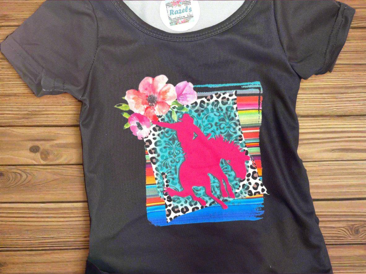 Cowgirl Bell Bottom Outfit featuring Pink Bronc Rider silhouettes and bold animal print! Perfect for rodeo fans and little ones who love a touch of Western flair, this Girls Bell Bottom Set is both stylish and fun. Ships FREE with $35+ order