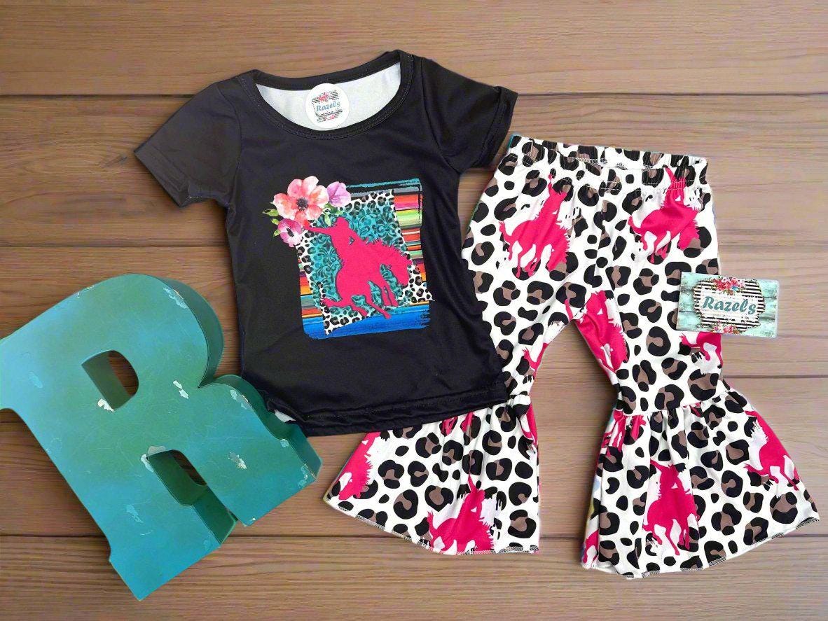 Cowgirl Bell Bottom Outfit featuring Pink Bronc Rider silhouettes and bold animal print! Perfect for rodeo fans and little ones who love a touch of Western flair, this Girls Bell Bottom Set is both stylish and fun. Ships FREE with $35+ order