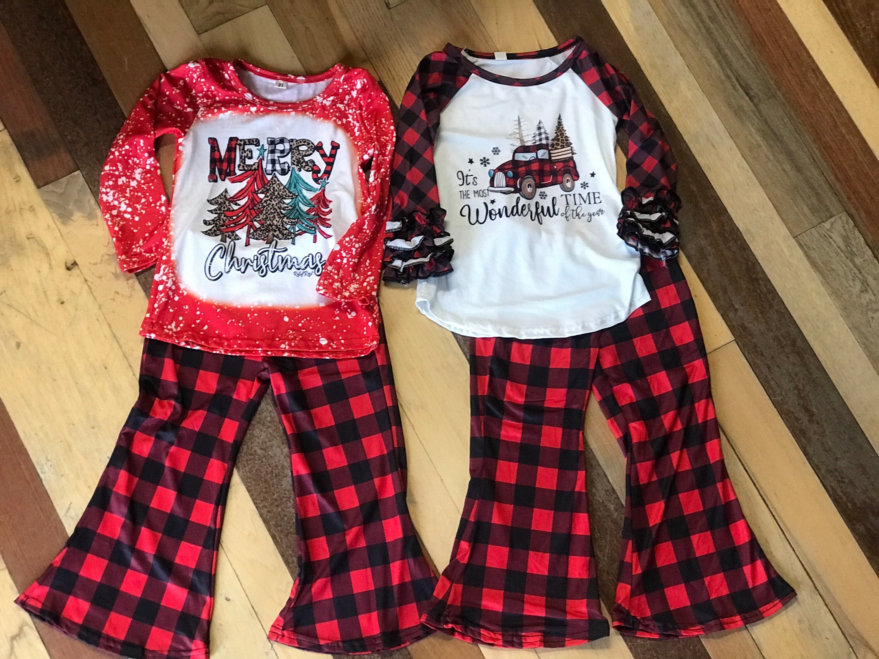girls christmas outfits featuring red and black checkered buffalo plaid trouser pants and your choice of Merry Christmas or It's the Most Wonderful Time of the Year Long Sleeve Shirts