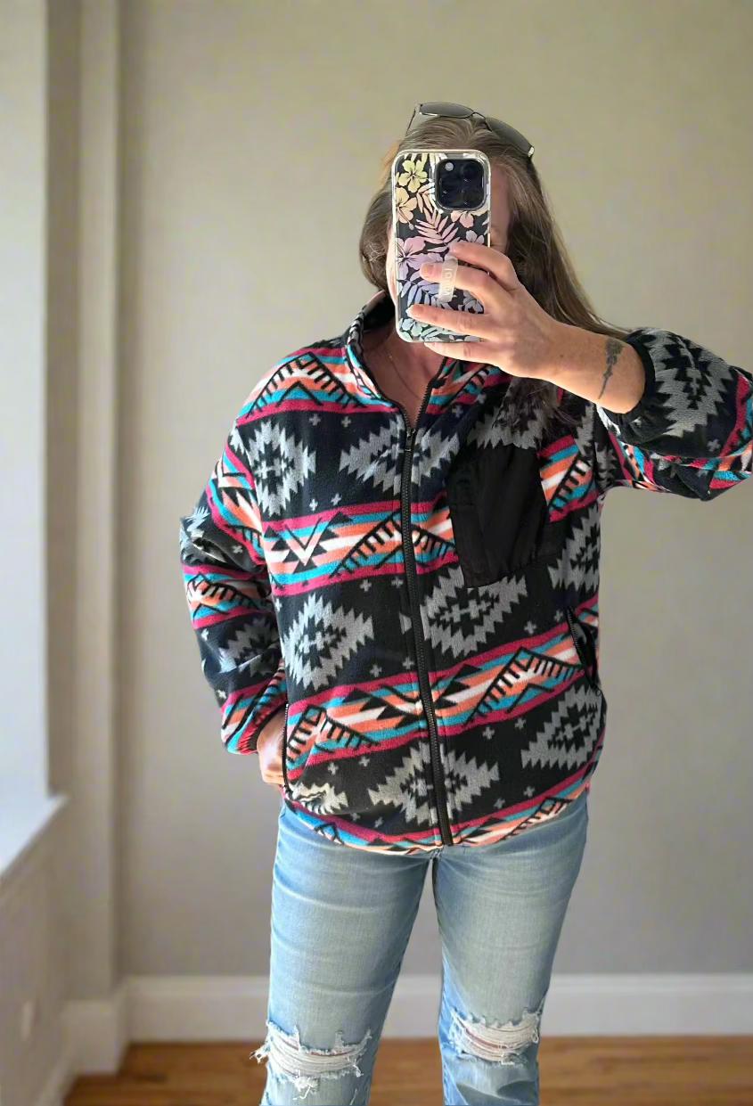 Western Fleece Jacket, Aztec Fleece Jacket, Spring Fleece Jacket, Western Zip Up features a vibrant Aztec print in black, grey, hot pink, orange, and turquoise pattern. With a convenient zip-up design, this jacket is perfect for all seasons.