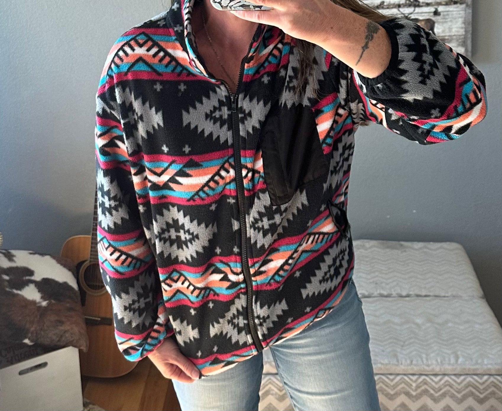 Western Fleece Jacket, Aztec Fleece Jacket, Spring Fleece Jacket, Western Zip Up features a vibrant Aztec print in black, grey, hot pink, orange, and turquoise pattern. With a convenient zip-up design, this jacket is perfect for all seasons.