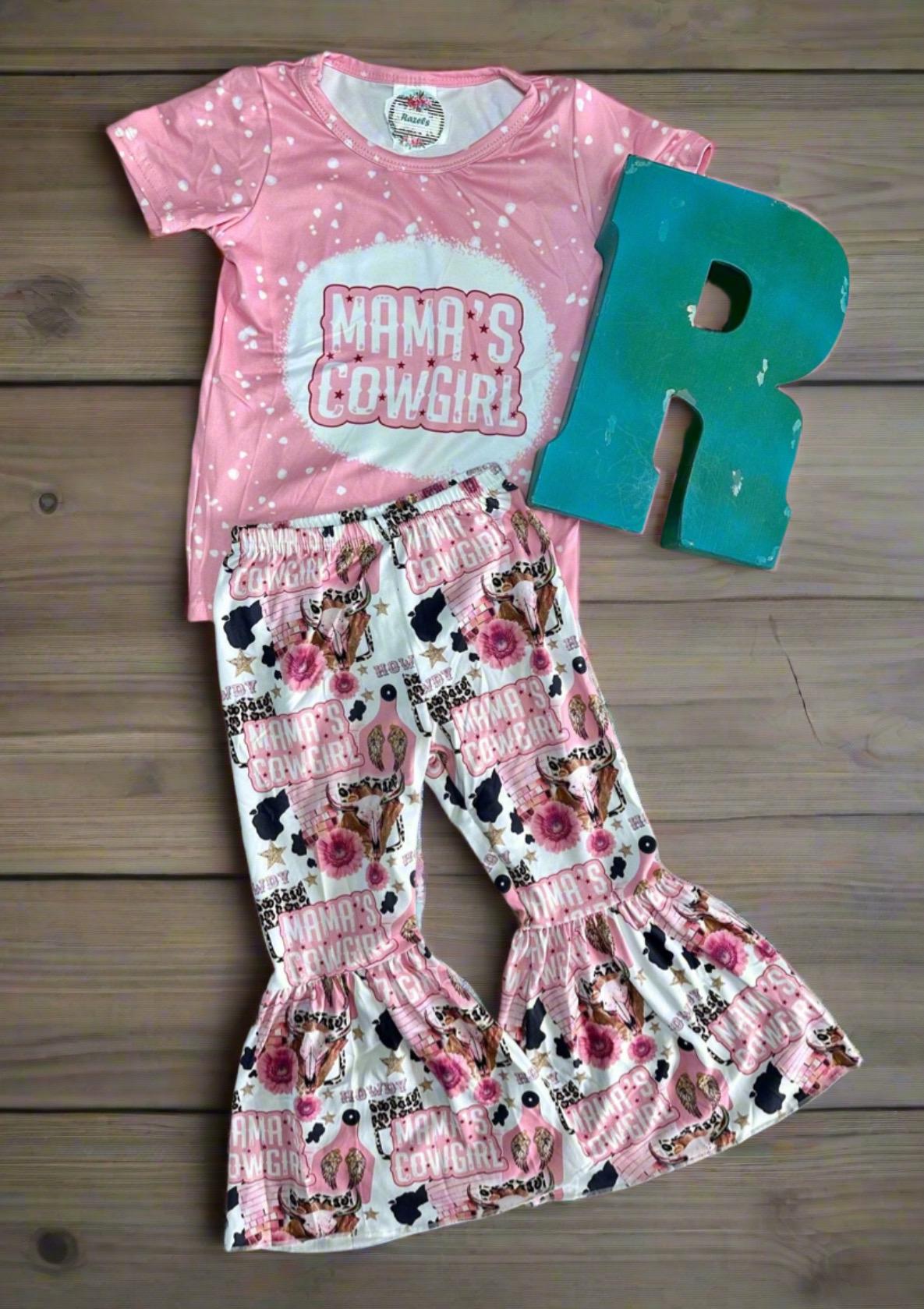 Mama’s Cowgirl Bell Bottom Outfit features a pink bleach-splattered tee with Mama's Cowgirl on the front and the bell bottom pants feature the funnest cowgirl motif with cheetah rodeo back numbers, disco balls, cow skulls, cowprint, and gold stars!