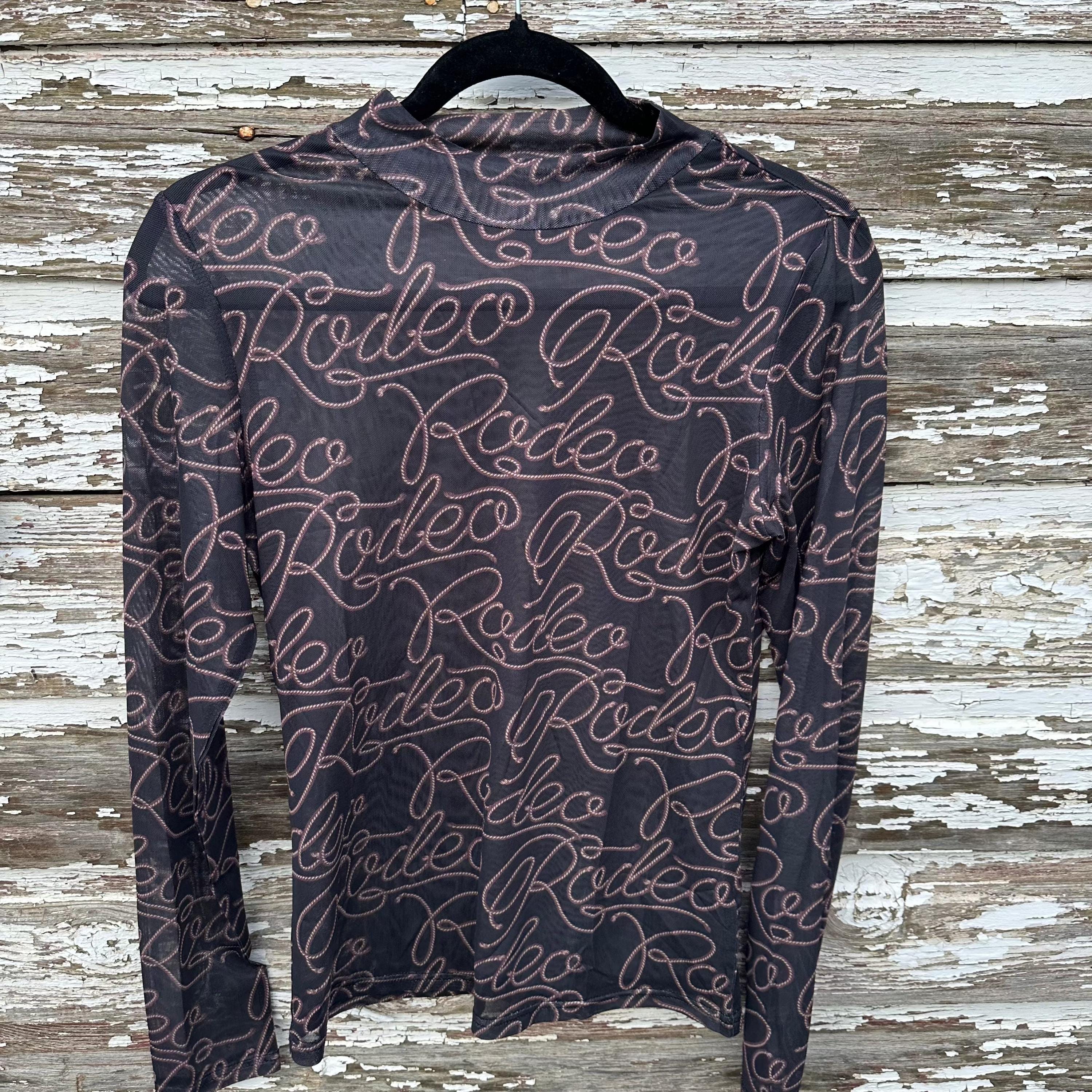 Rodeo Shirt, Western SHEER Shirt, Rodeo Nights T-Shirt, Cowgirl Shirt, Layering Shirt
Turn heads on rodeo nights with this bold Western SHEER Shirt! This cowgirl shirt features a striking RODEO print on soft, breathable mesh—perfect for layering over your favorite Rodeo Nights T-shirt or wearing on its own.
✔ Lightweight, breathable mesh for all-day comfort
✔ Stylish sheer design for layering or standalone wear
✔ Bold RODEO print for a statement Western look
FREE SHIPPING $35+ FROM MONTANA