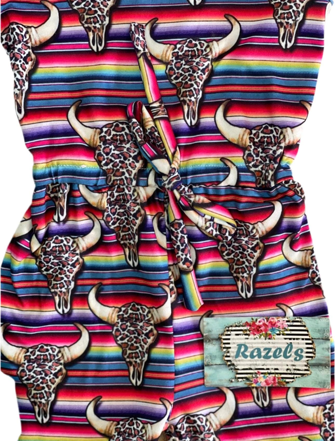 The Western Bell Bottom Jumpsuit is here to steal the spotlight! 🤠😍 This Cowgirl Outfit is a total showstopper, blending style and comfort effortlessly. With its Serape Jumpsuit vibes, cow skulls, and cheetah print, it’s the perfect mix of Western flair and bold fashion.
Designed for all-day wear, the Bell Bottom Romper features an elastic waistband for the perfect fit, making it as practical as it is stylish. Plus Razels ships all orders $35+ FREE from MONTANA TODAY!