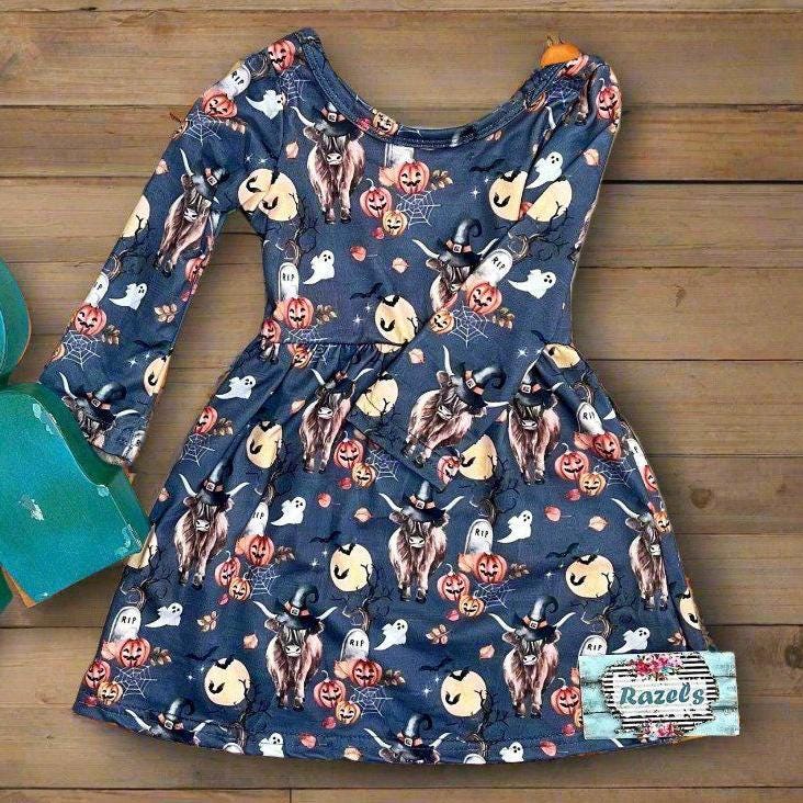 Highland Cow HALLOWEEN Dress: Western long-sleeve dress for girls featuring Highland cows in witches hats, bats, RIP graves stones, pumpkins, the full moon, spiderwebs, and more. Perfect all Fall.