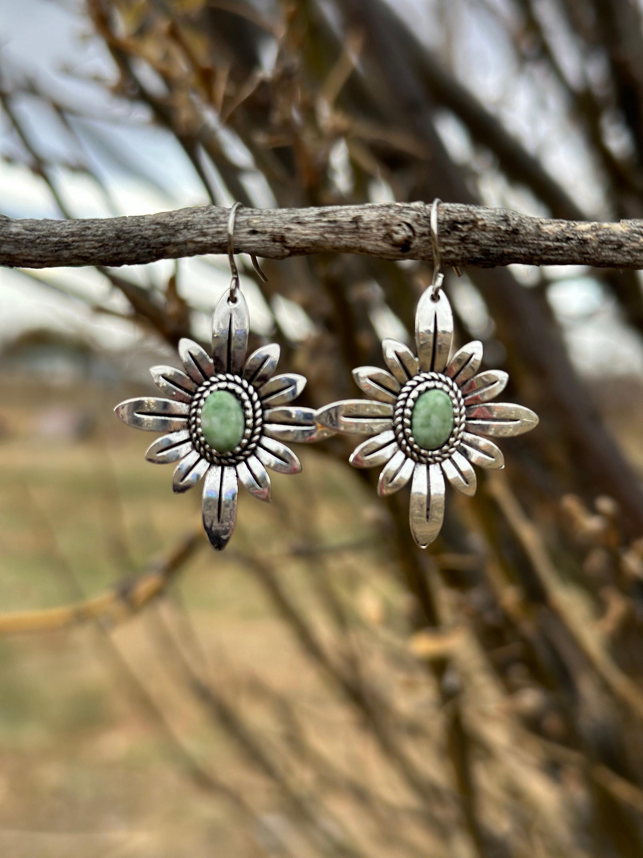 Light Green Earrings | WESTERN FLOWER Earrings | Western Dangle Earrings | Stamped Silver Earring | Cowgirl Earrings Featuring a delicate stamped silver floral design with a light green center stone. Ships FREE with $35+ purchase. Great Western Gift!