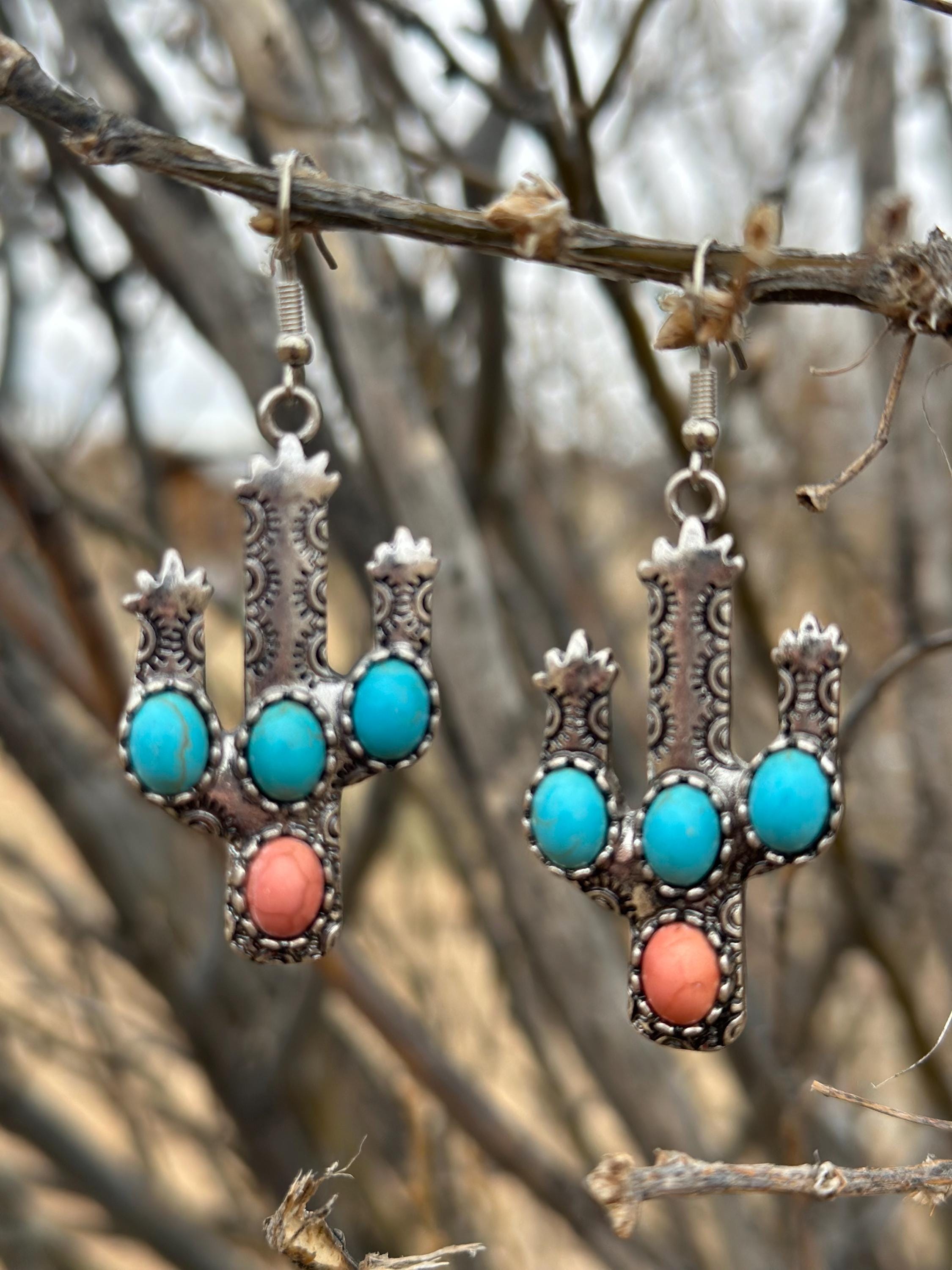 Western Cactus Earrings, featuring turquoise and coral stone accents. Lightweight and comfy these Cactus Earrings are perfect for daily wear or special occasions. Shop Razels—FREE shipping on $35+ orders! 🌵✨